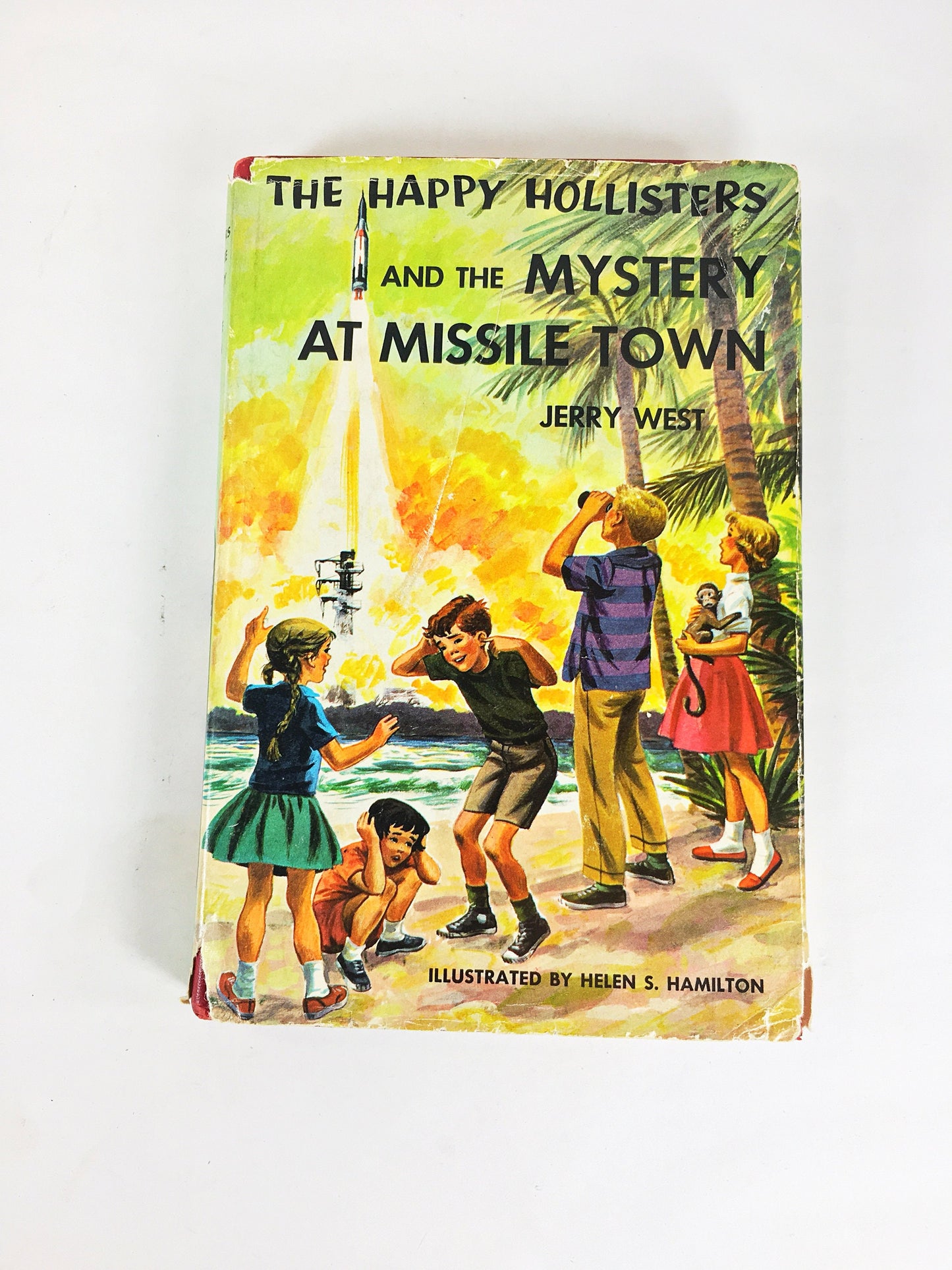 1961 Happy Hollisters and the Mystery at Missile Town. Vintage book by Jerry West with dust jacket. Cloth Bound Mystery Stories