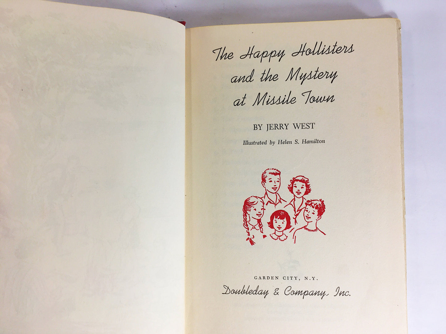 1961 Happy Hollisters and the Mystery at Missile Town. Vintage book by Jerry West with dust jacket. Cloth Bound Mystery Stories