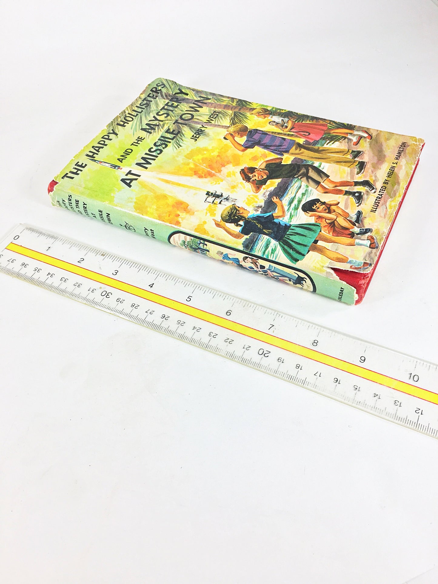 1961 Happy Hollisters and the Mystery at Missile Town. Vintage book by Jerry West with dust jacket. Cloth Bound Mystery Stories