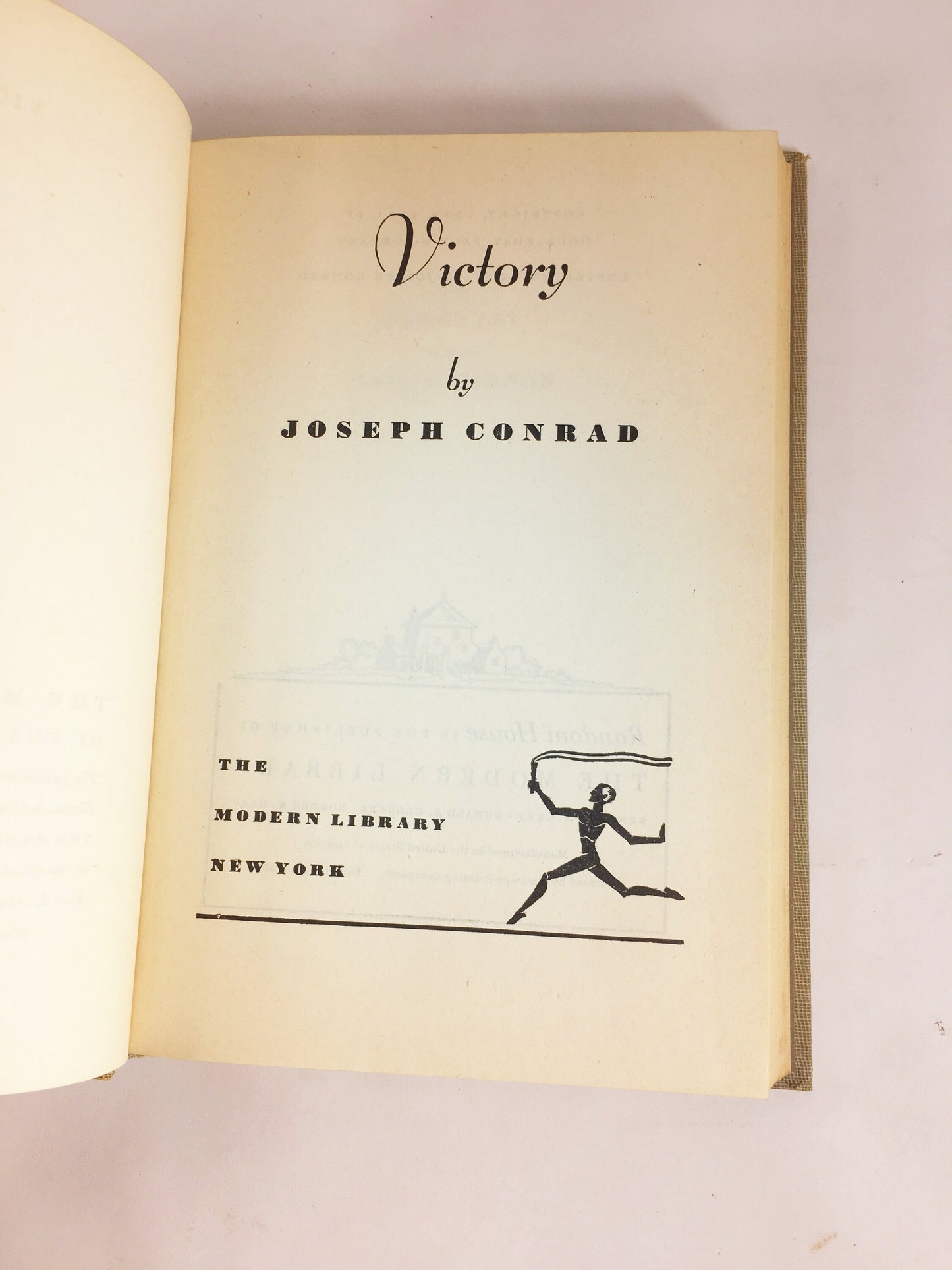 Victory by Joseph Conrad circa 1921. Psychological novel about a man who learned not to hope or love. Gray cloth covered Modern Library Book