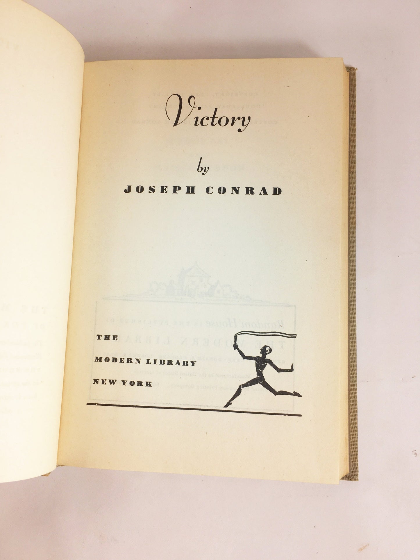 Victory by Joseph Conrad circa 1921. Psychological novel about a man who learned not to hope or love. Gray cloth covered Modern Library Book