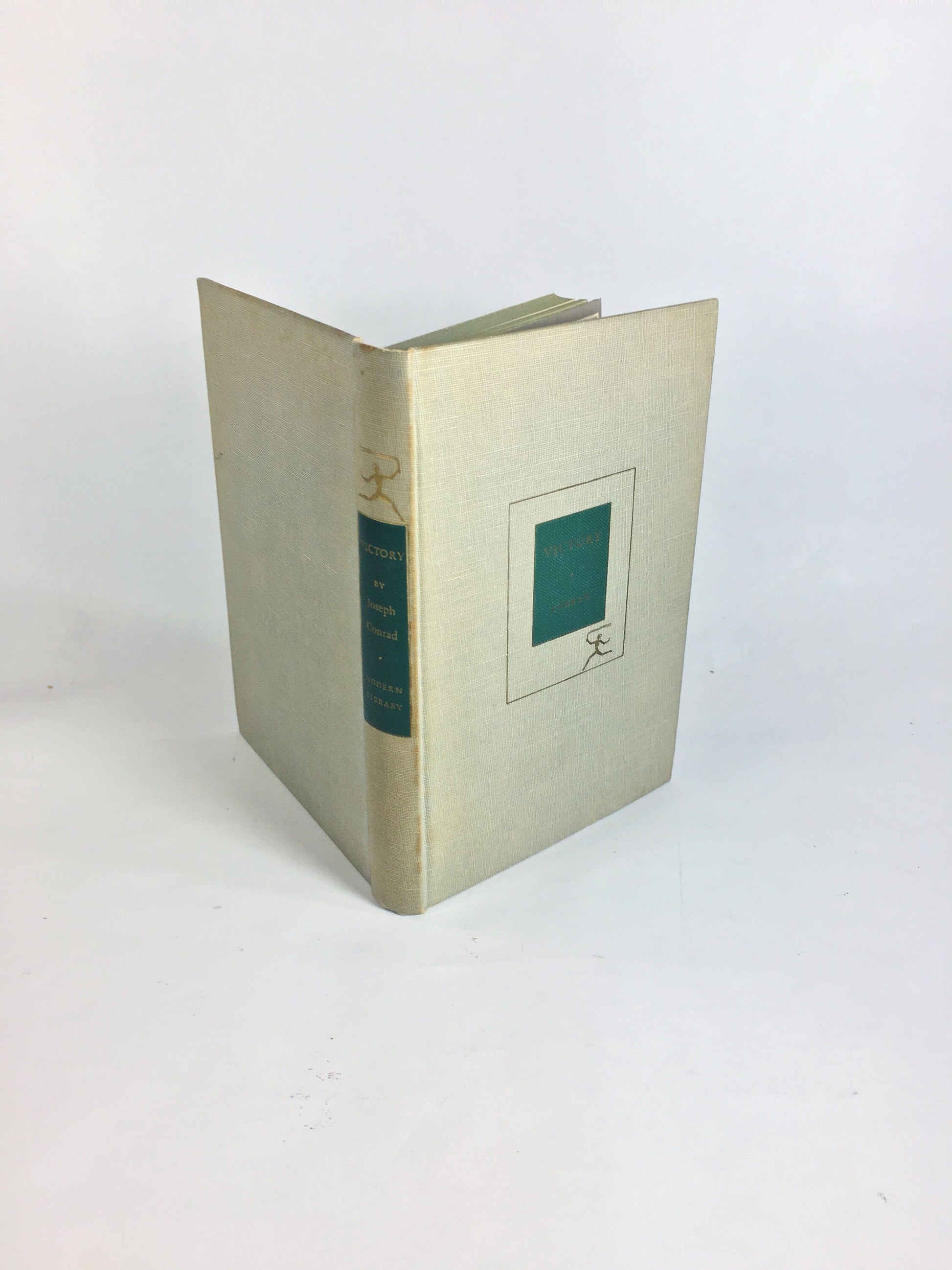 Victory by Joseph Conrad circa 1921. Psychological novel about a man who learned not to hope or love. Gray cloth covered Modern Library Book