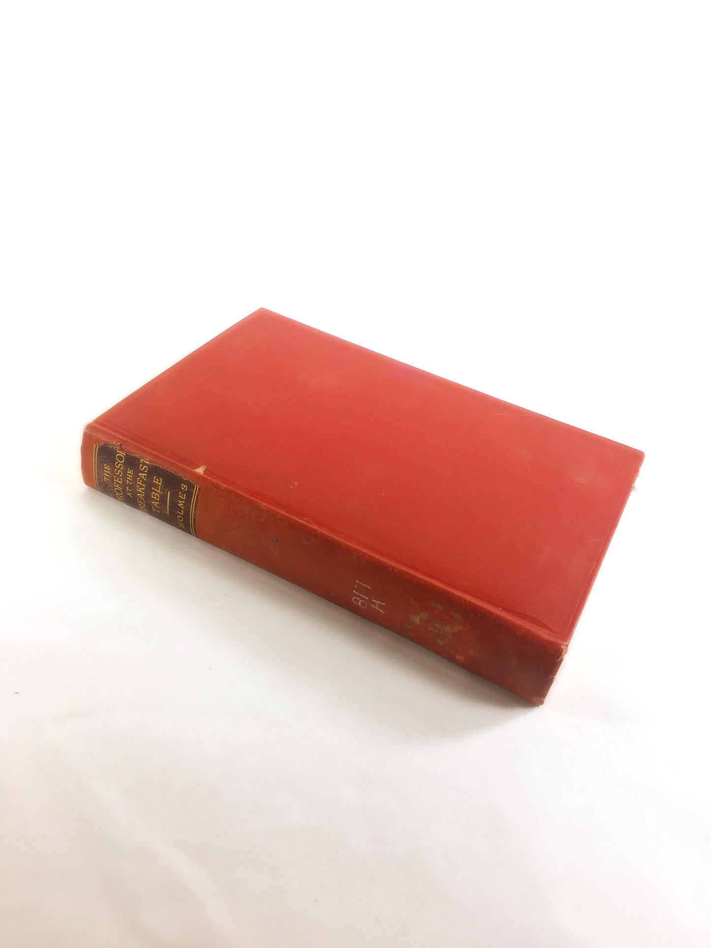 1892 Oliver Wendell Holmes The Autocrat Professor at the Breakfast Table. Vintage red book of a collection of essays. Decor prop staging
