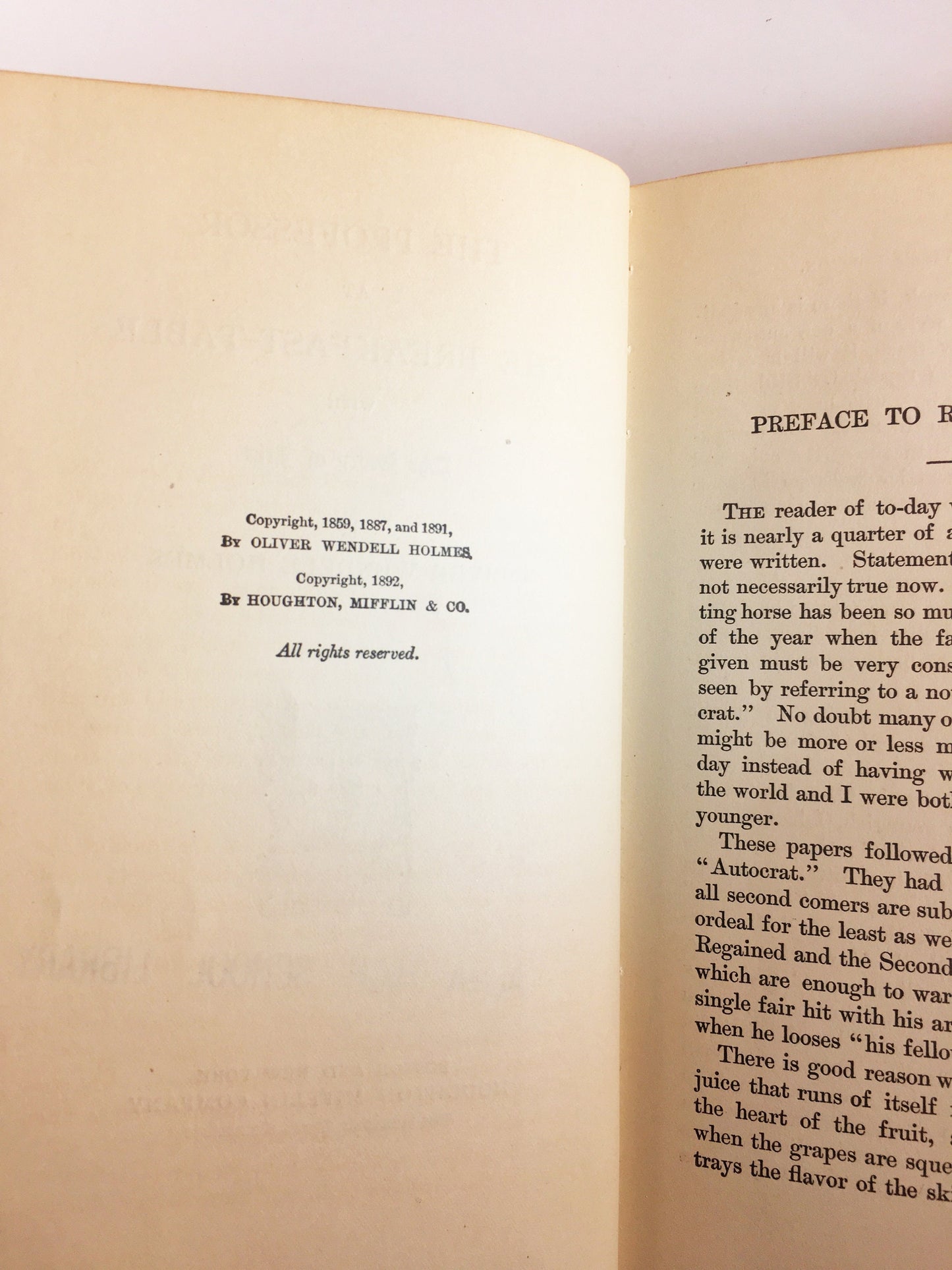 1892 Oliver Wendell Holmes The Autocrat Professor at the Breakfast Table. Vintage red book of a collection of essays. Decor prop staging