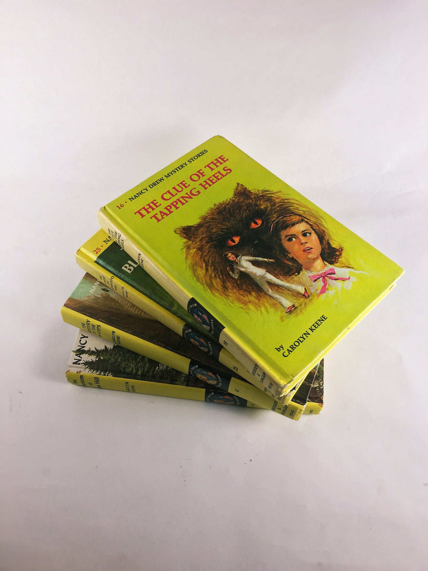 Nancy Drew Mystery Stories 1960s 1970 by Carolyn Keene. Vintage picture cover books with black & white endpapers. Teen tween reading yellow