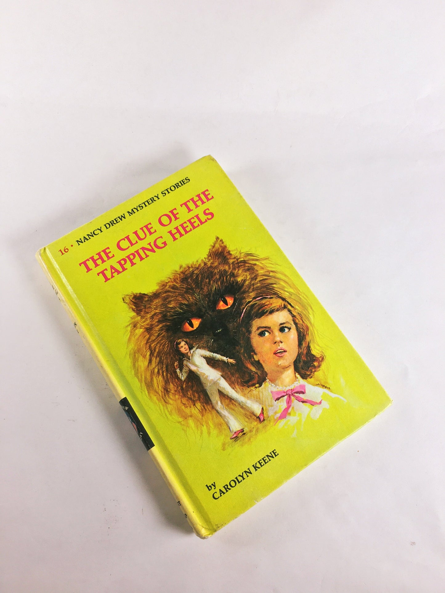 Nancy Drew Mystery Stories 1960s 1970 by Carolyn Keene. Vintage picture cover books with black & white endpapers. Teen tween reading yellow