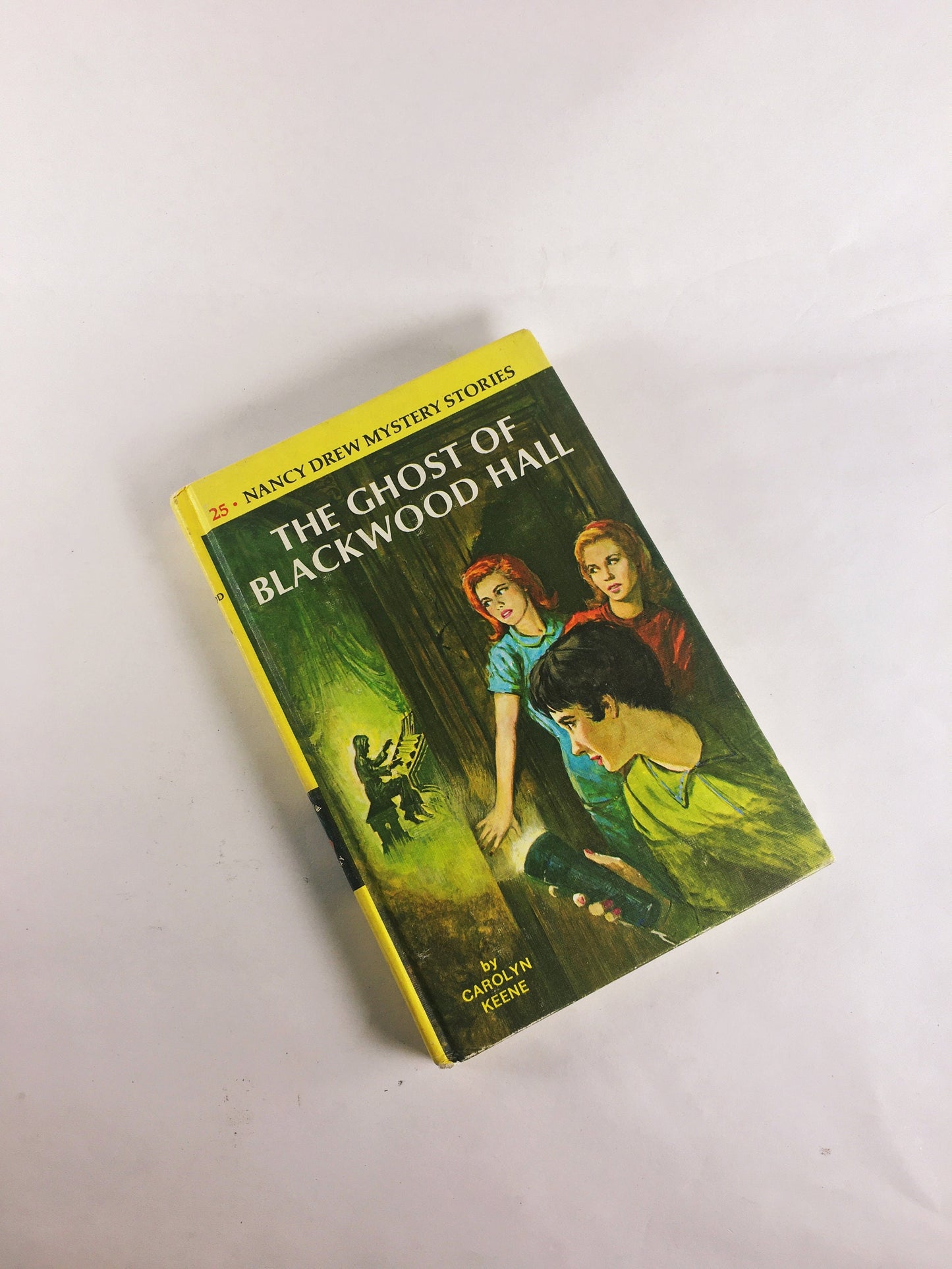 Nancy Drew Mystery Stories 1960s 1970 by Carolyn Keene. Vintage picture cover books with black & white endpapers. Teen tween reading yellow