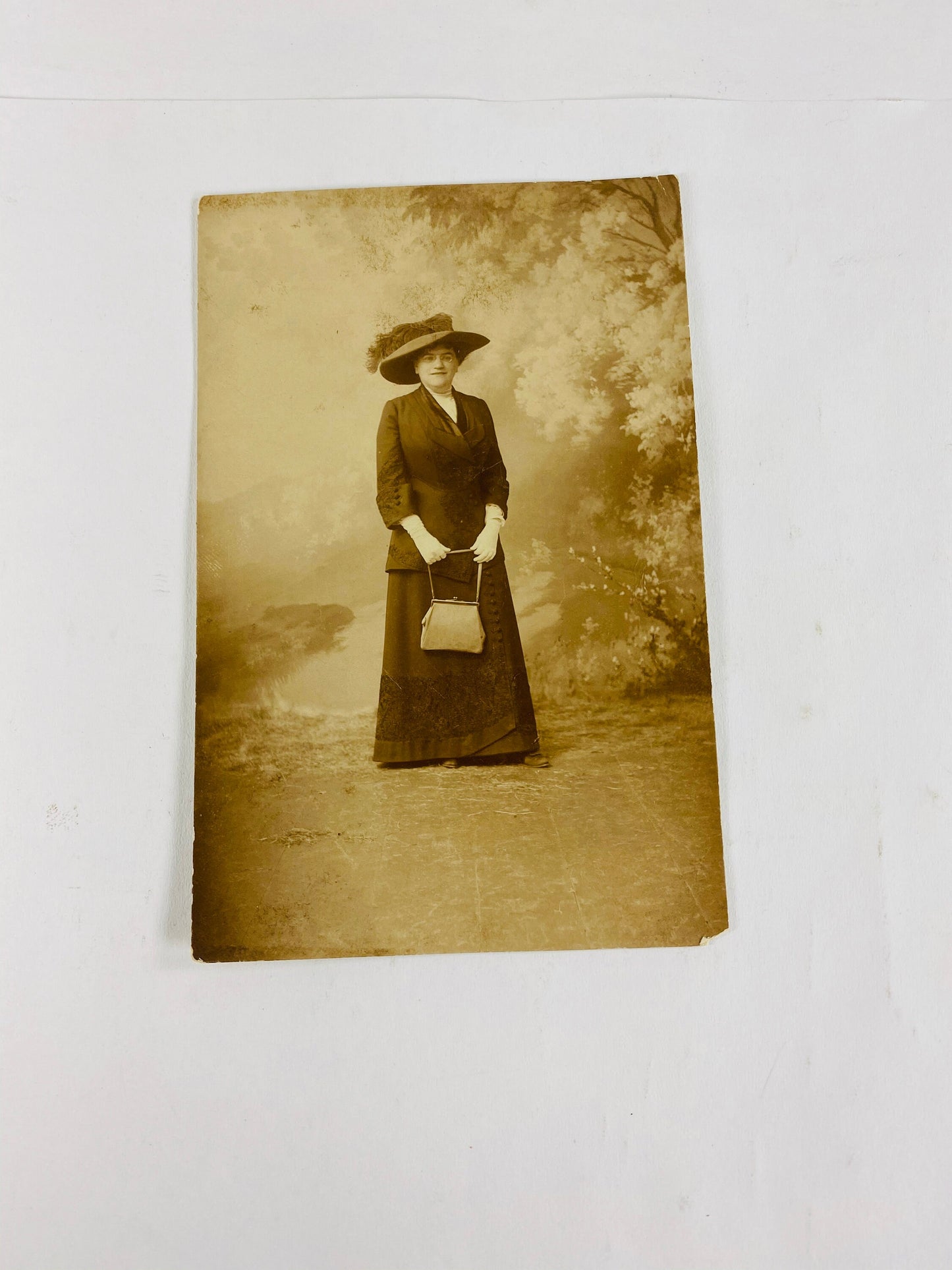 1908 vintage RPPC women postcard B&W stamped. BEAUTIFUL home office decor for framing. Flowers, Dress with hat and purse, family, standing