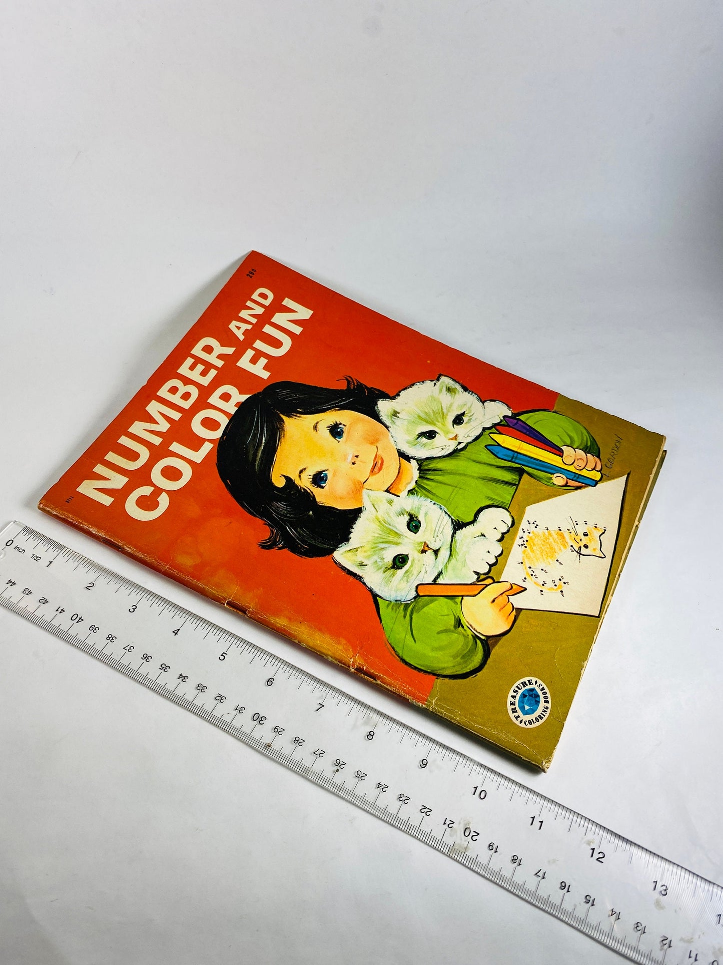 1953 Treasure Coloring Book. Vintage red activity book for children from the 1950s with some blank pages some colored. Missing Title Page