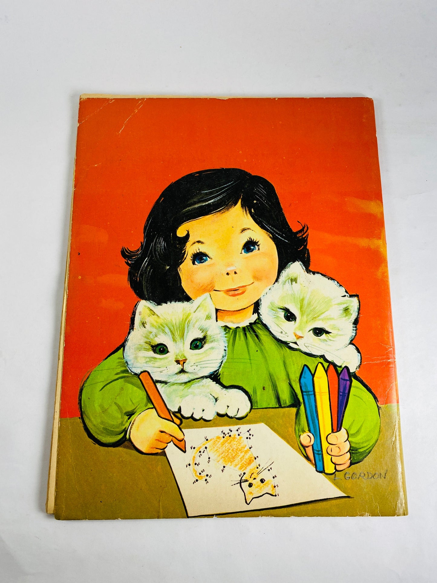 1953 Treasure Coloring Book. Vintage red activity book for children from the 1950s with some blank pages some colored. Missing Title Page