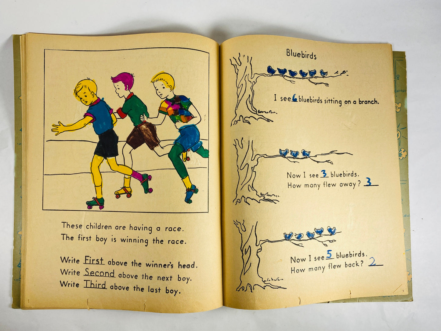 1953 Treasure Coloring Book. Vintage red activity book for children from the 1950s with some blank pages some colored. Missing Title Page