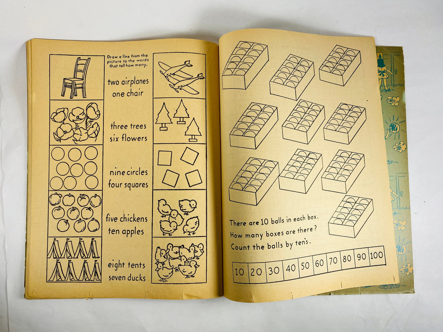 1953 Treasure Coloring Book. Vintage red activity book for children from the 1950s with some blank pages some colored. Missing Title Page