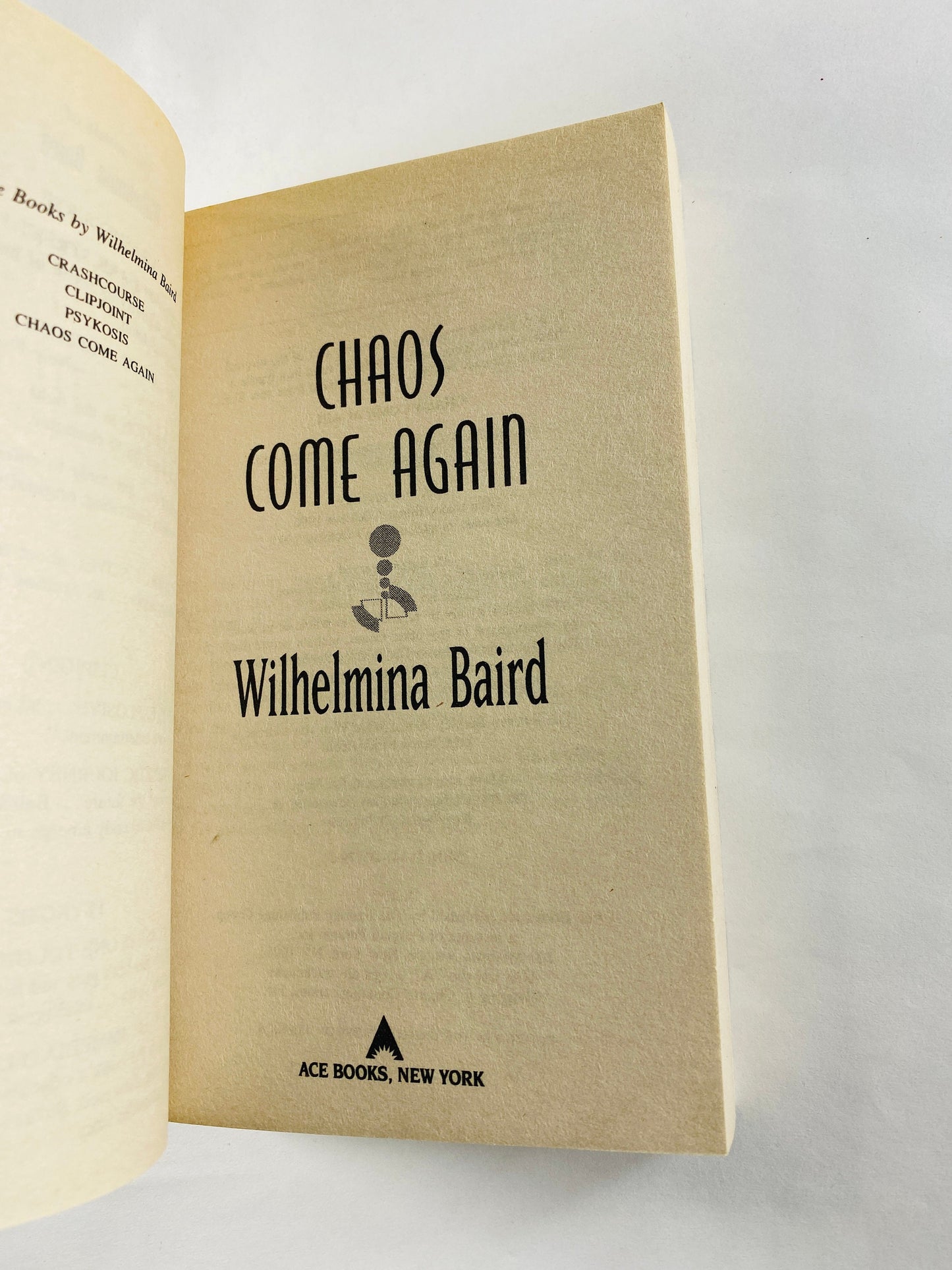 Chaos Come Again by Wilhemina Baird vintage paperback book 1997 about symbiotes in a telepathic evolution. Science fiction female author