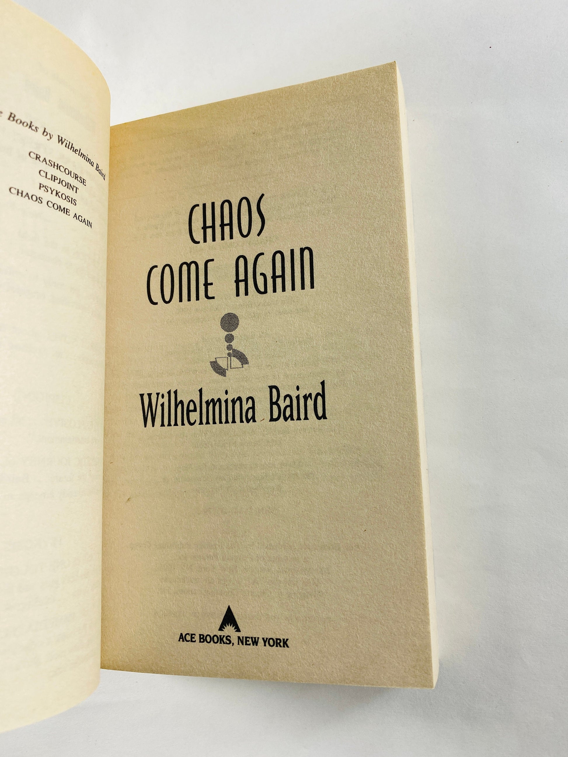 Chaos Come Again by Wilhemina Baird vintage paperback book 1997 about symbiotes in a telepathic evolution. Science fiction female author