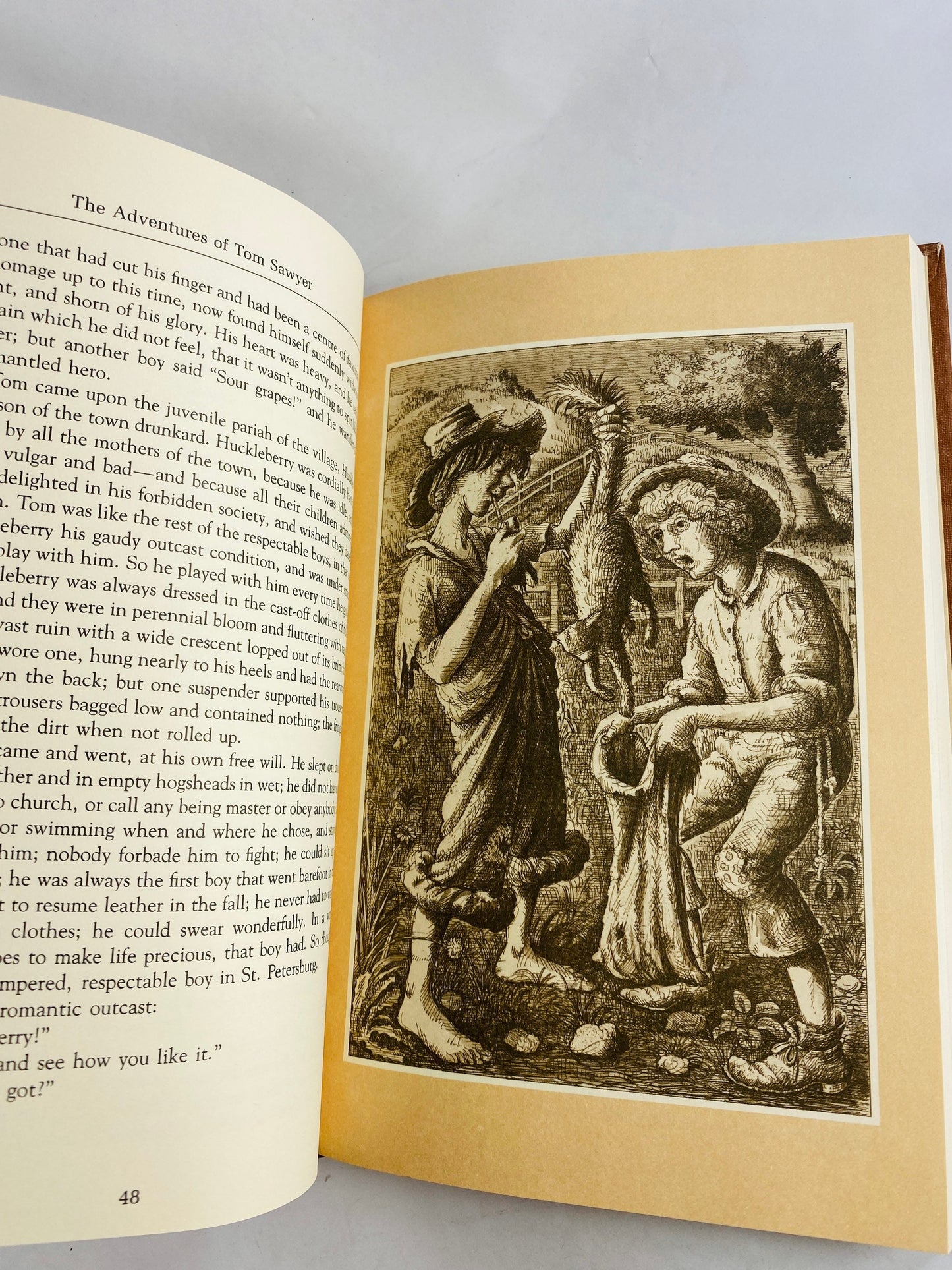 Adventures of Tom Sawyer by Samuel Clemens Mark Twain Vintage Reader's Digest book circa 1986. Brown & gold bookshelf decor