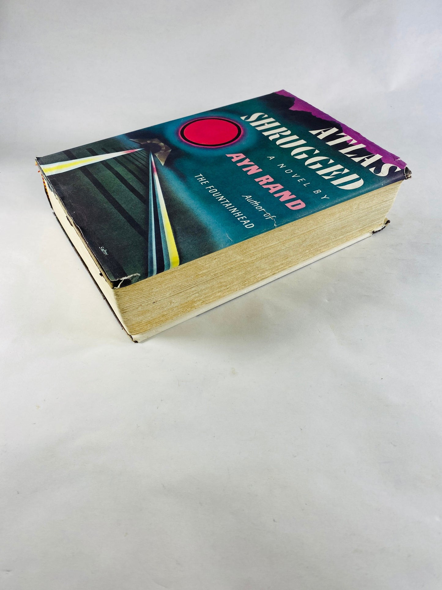 Atlas Shrugged vintage book by Ayn Rand EARLY PRINTING with dust jacket black cloth binding with deckled edges. Intellectual decor