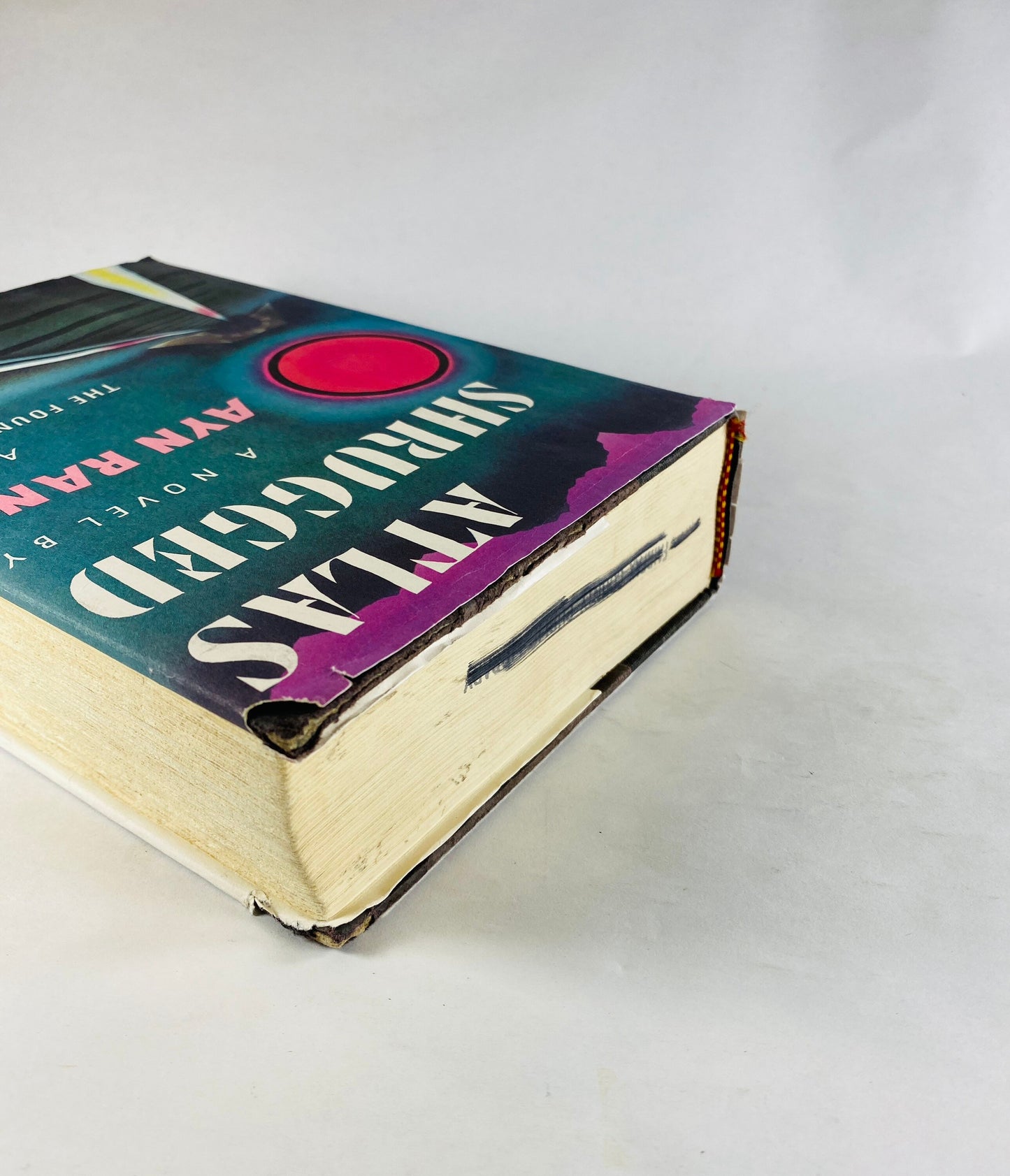 Atlas Shrugged vintage book by Ayn Rand EARLY PRINTING with dust jacket black cloth binding with deckled edges. Intellectual decor