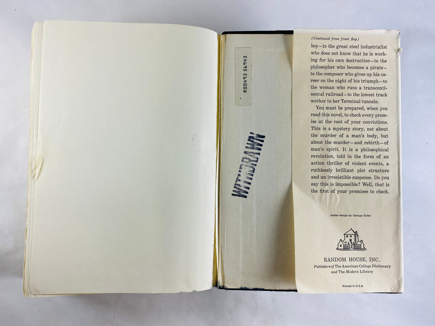 Atlas Shrugged vintage book by Ayn Rand EARLY PRINTING with dust jacket black cloth binding with deckled edges. Intellectual decor