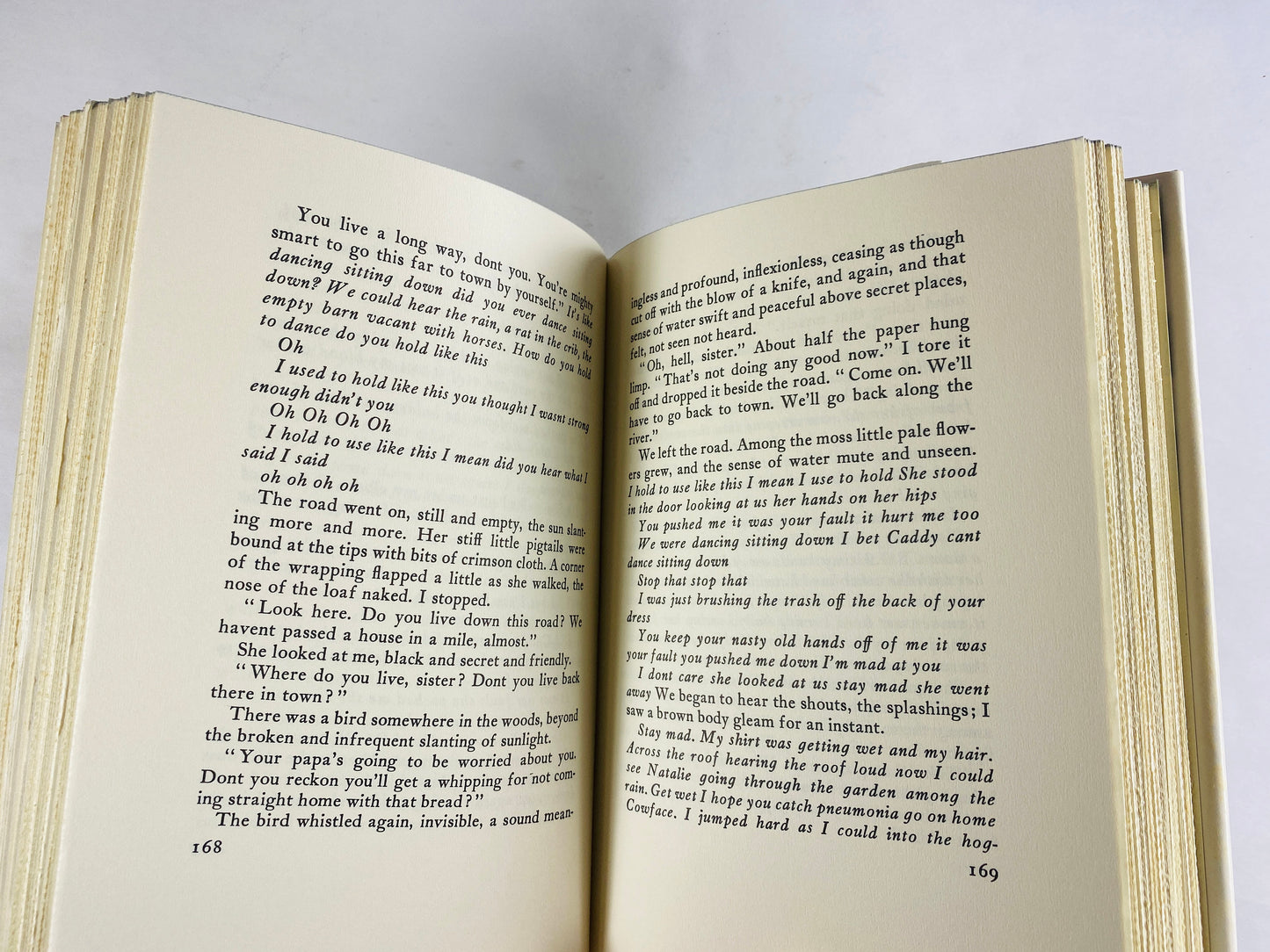 Sound and the Fury vintage book by William Faulkner Tragedy set in Mississippi about former Southern aristocrats and loss of reputation 1984
