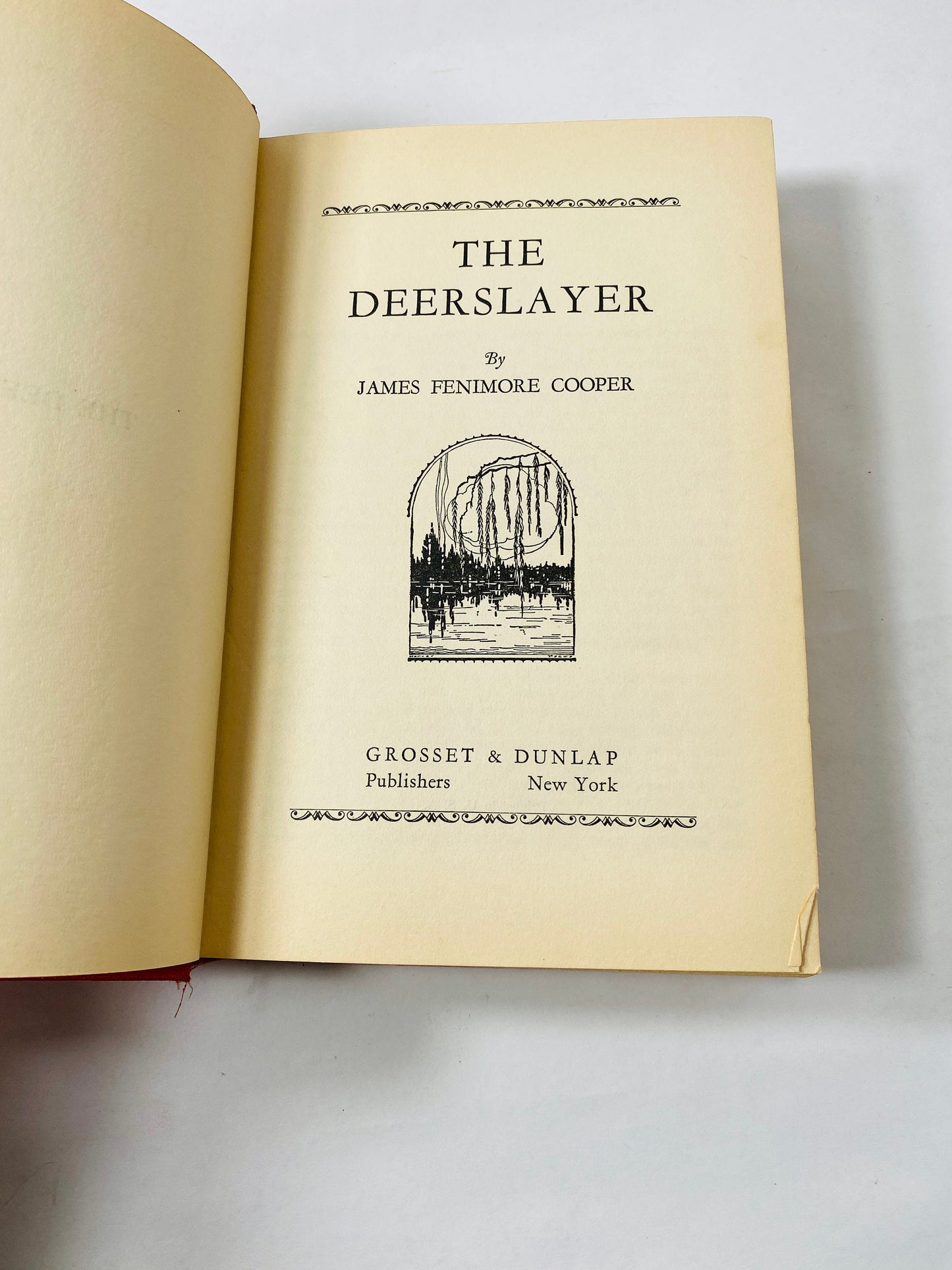 James Fenimore Cooper Deerslayer circa 1900 red vintage book with black embossing