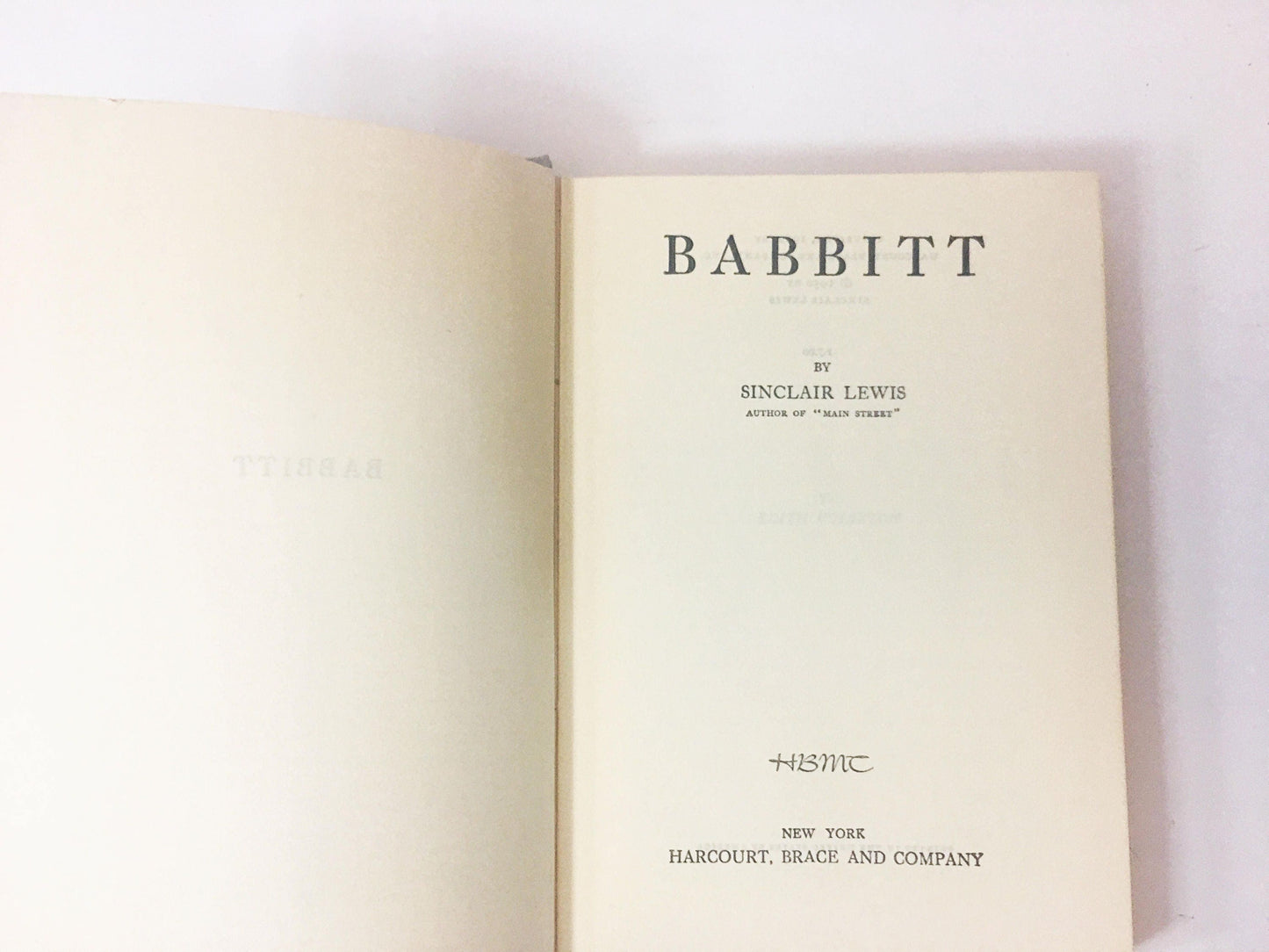 Babbitt vintage book by Sinclair Lewis circa 1950. Grey cloth Satirical novel about middle-class life and social pressure conformity.