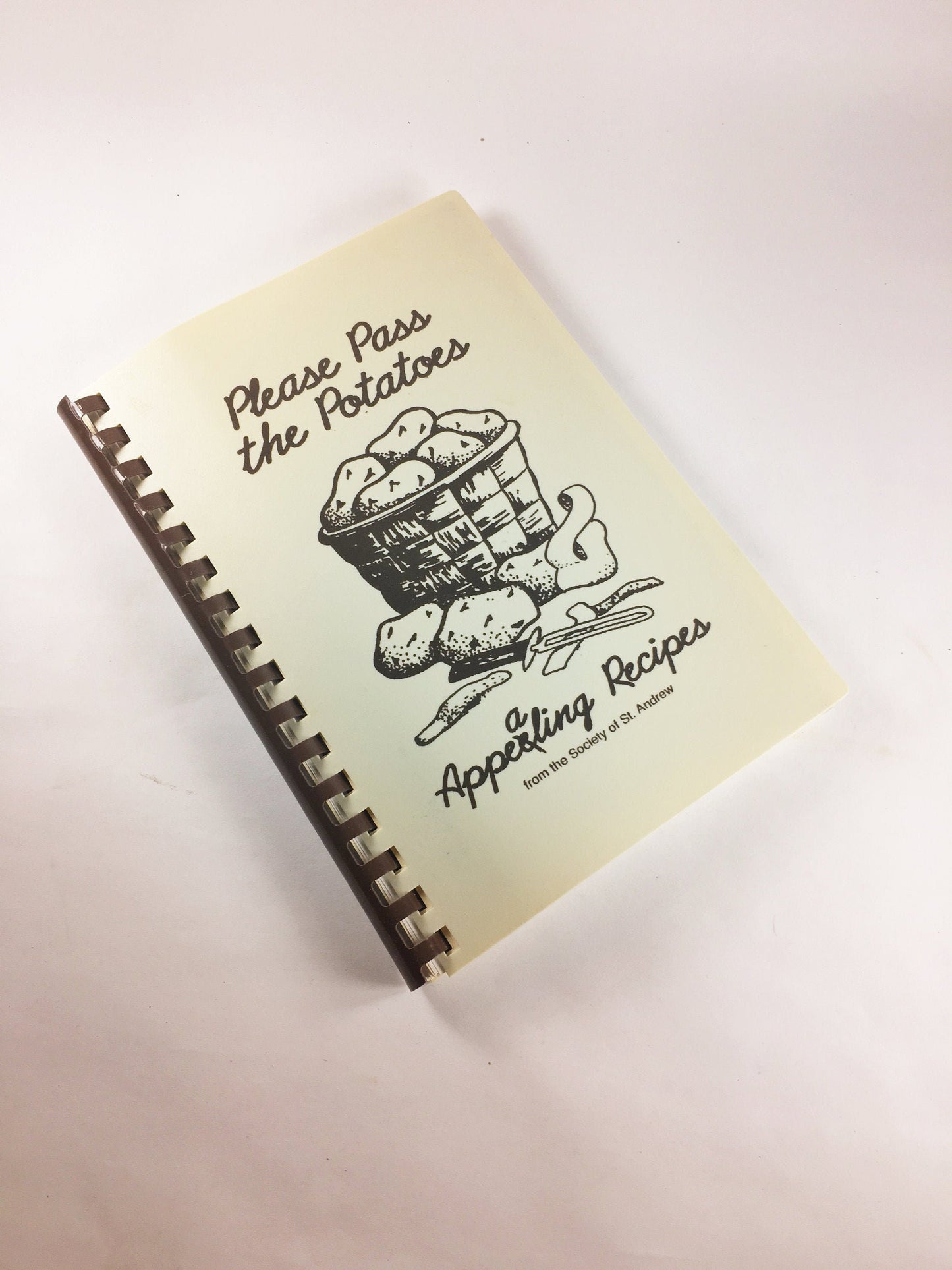 Please Pass the Potatoes. Vintage cookbook circa 1990 by Marian Buchanan, Laura Newell-Furniss and Ray A. Buchanan. Saint Andrews hunger