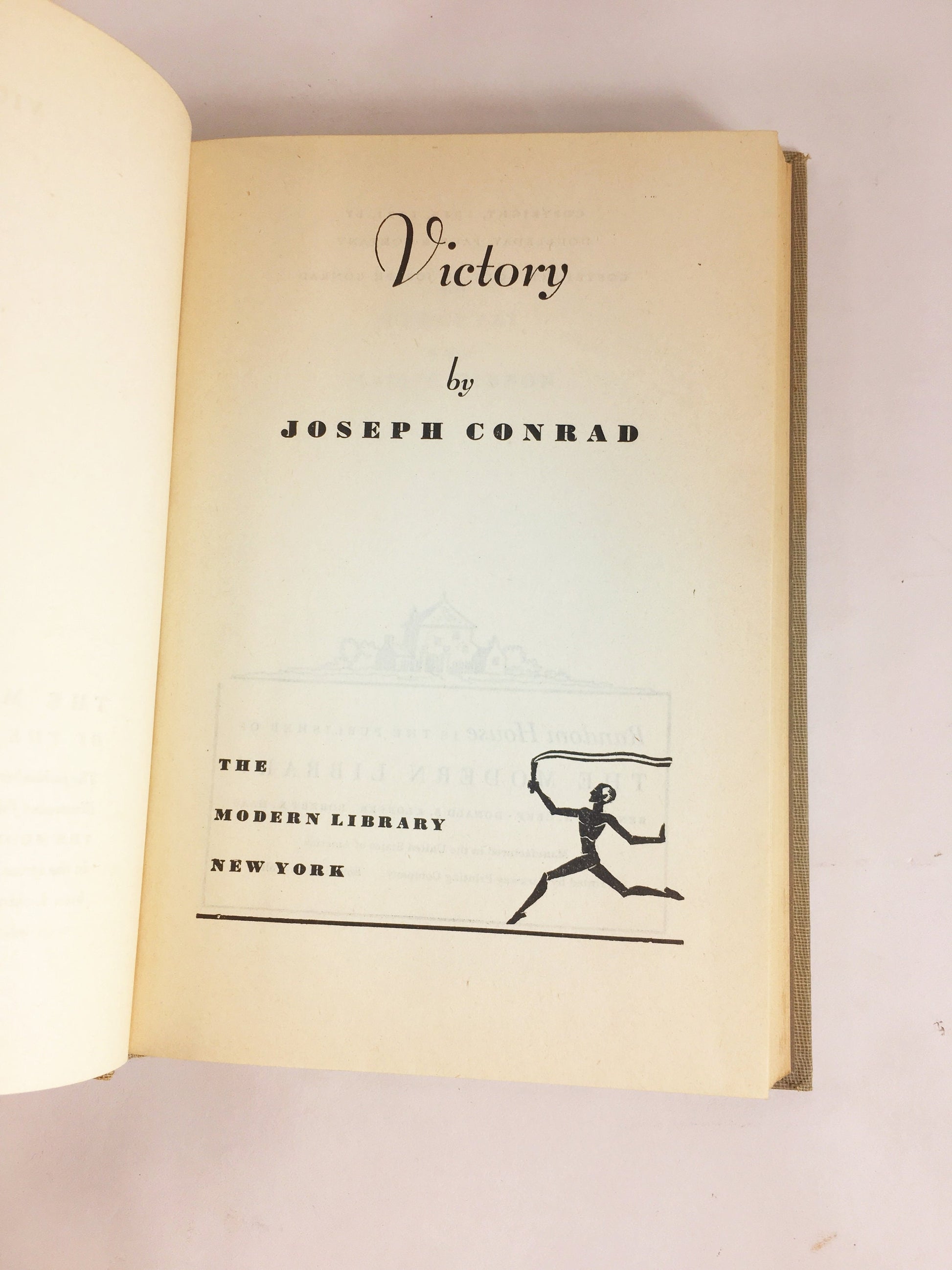 Victory by Joseph Conrad circa 1921. Psychological novel about a man who learned not to hope or love. Gray cloth covered Modern Library Book