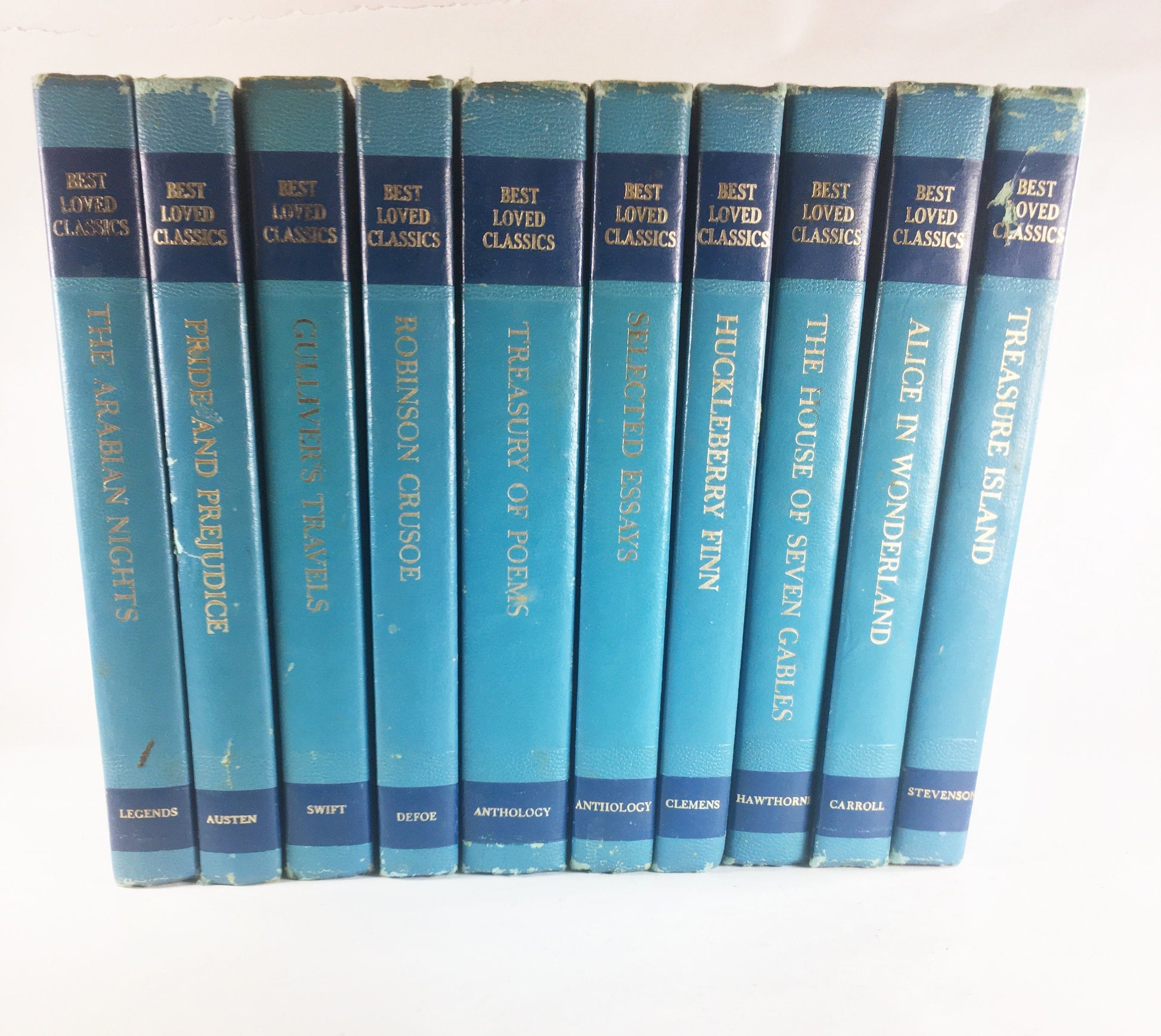 Alice in Wonderland, Pride & Prejudice Robinson Crusoe Huckleberry Finn Vintage Best Loved Classics sky blue book set circa 1949.