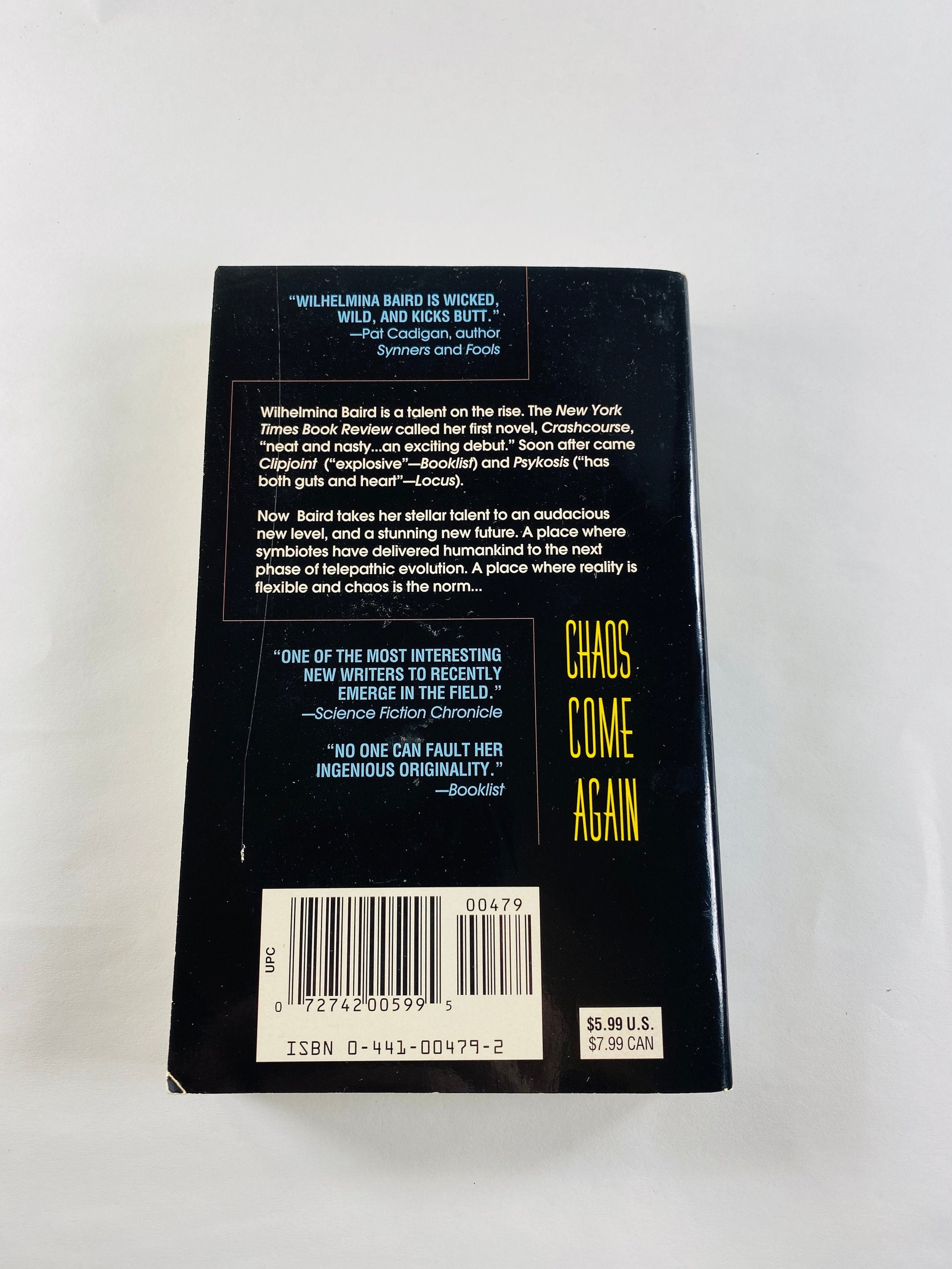 Chaos Come Again by Wilhemina Baird vintage paperback book 1997 about symbiotes in a telepathic evolution. Science fiction female author