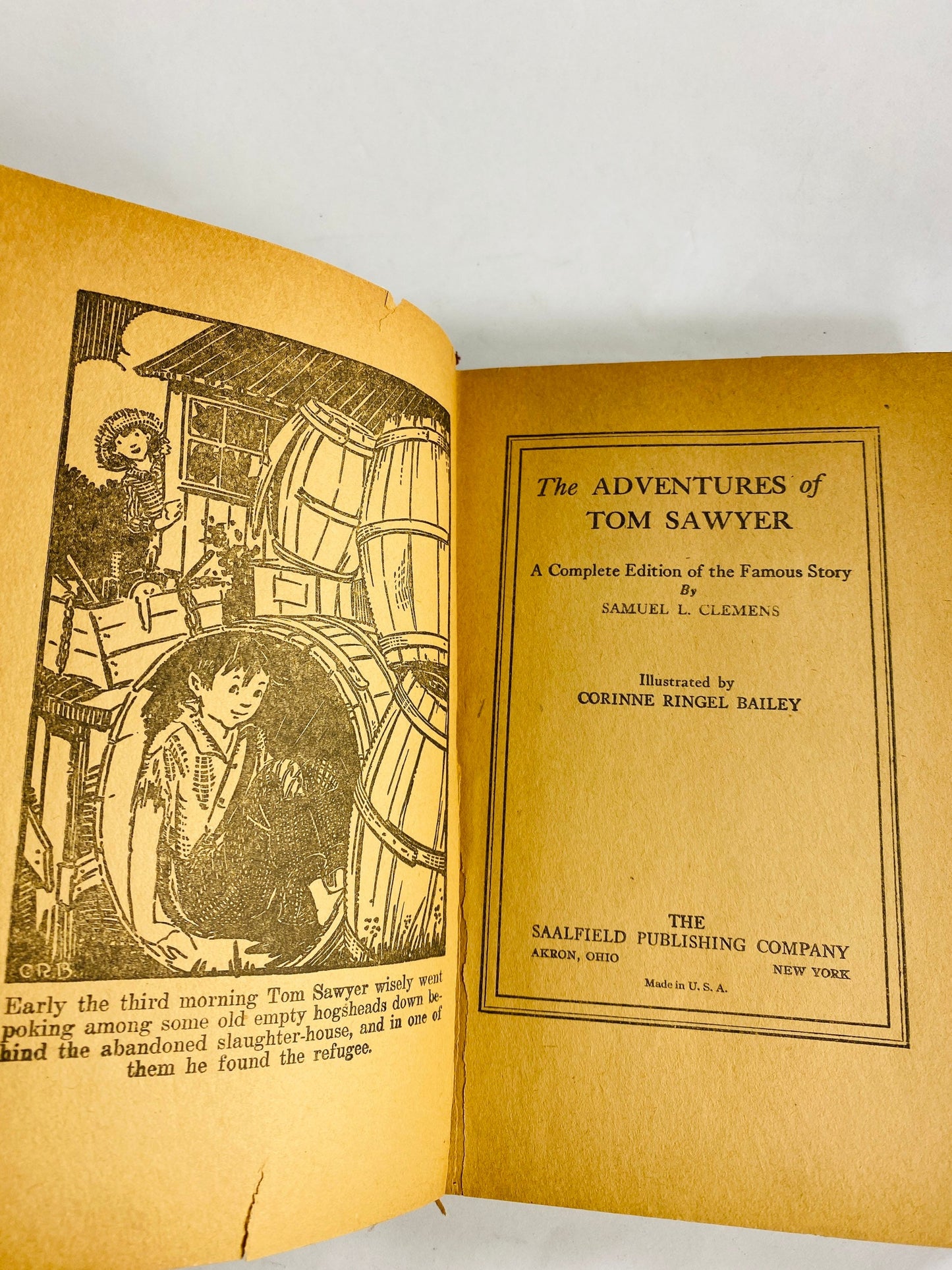 Adventures of Tom Sawyer by Samuel Clemens. Vintage red book circa 1931. Mark Twain small home bookshelf decor