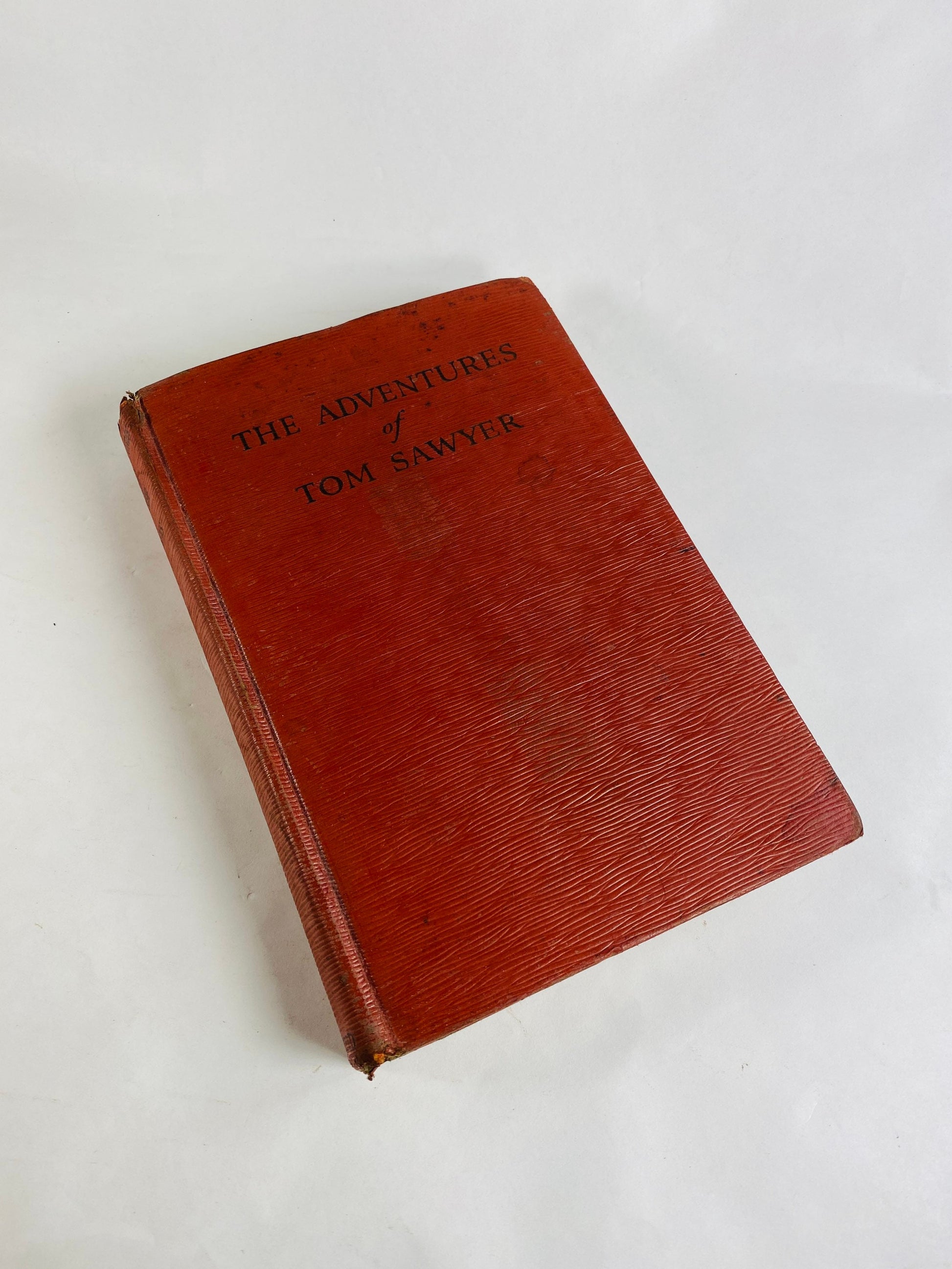 Adventures of Tom Sawyer by Samuel Clemens. Vintage red book circa 1931. Mark Twain small home bookshelf decor