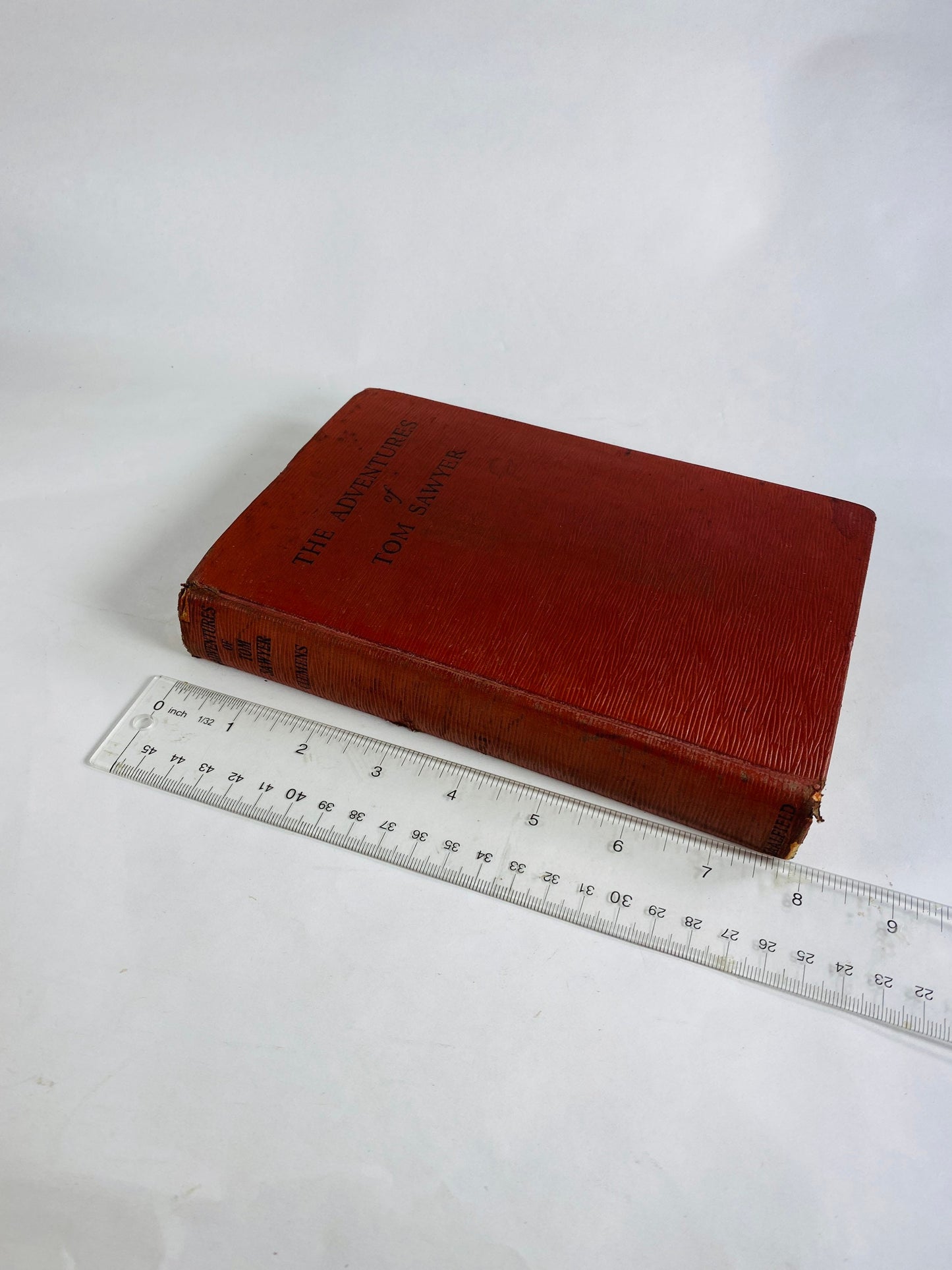 Adventures of Tom Sawyer by Samuel Clemens. Vintage red book circa 1931. Mark Twain small home bookshelf decor