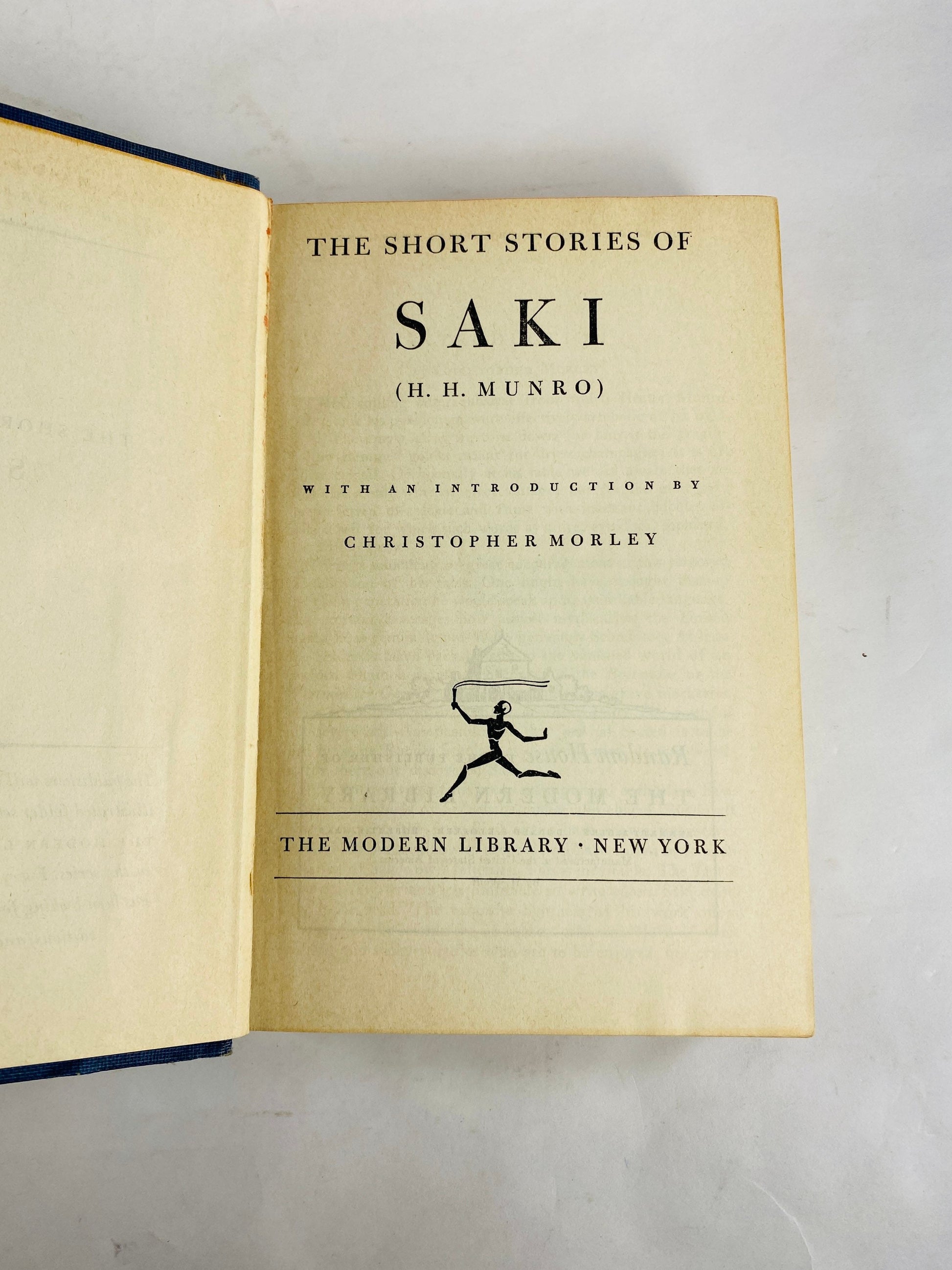 Short Stories of Saki Modern Library book circa 1930 HM Munro Master of the short story. Parody. Blue bookshelf decor