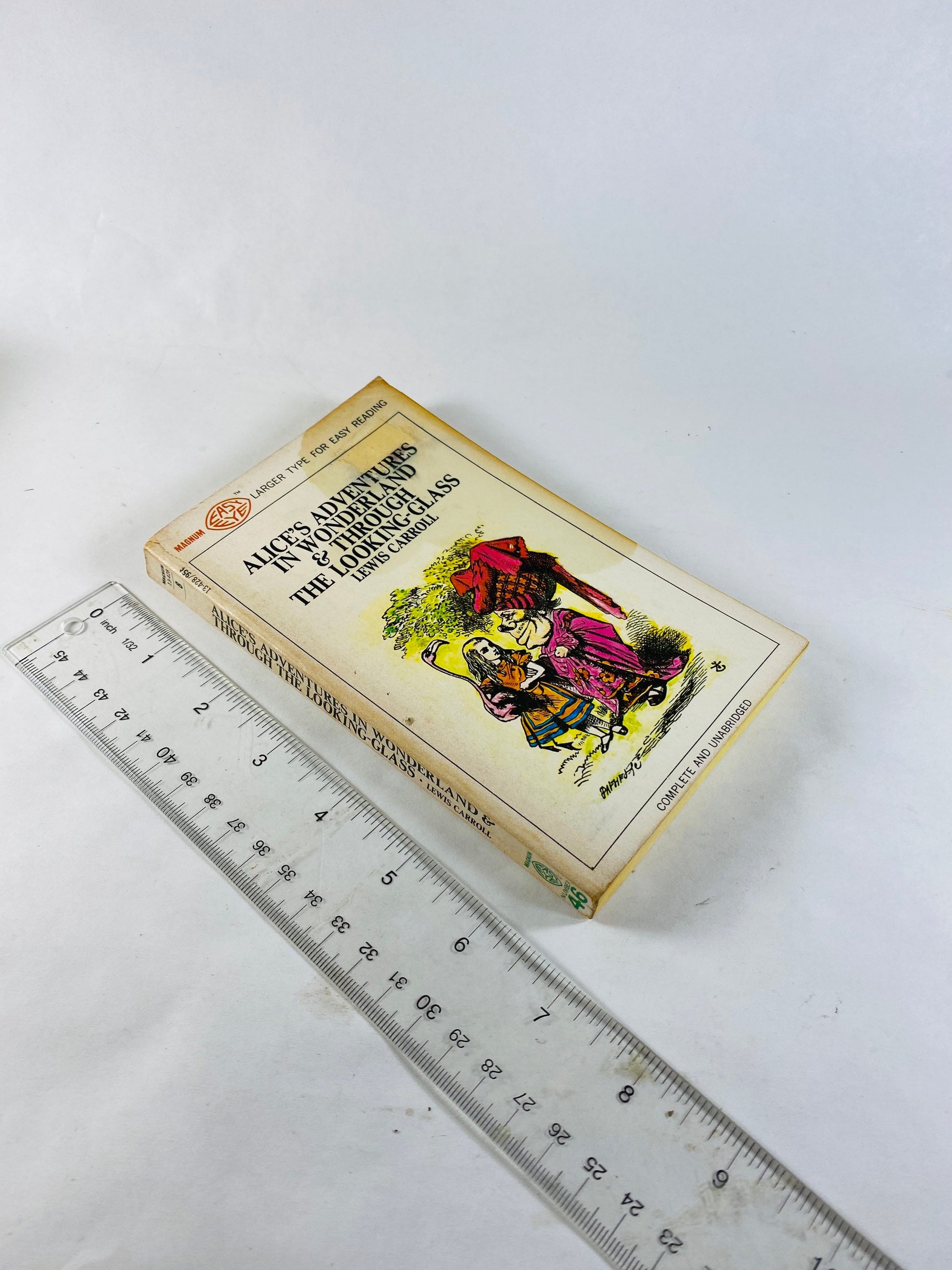 1968 Alice's Adventures in Wonderland & Through the Looking Glass Vintage paperback book by Lewis Carroll.