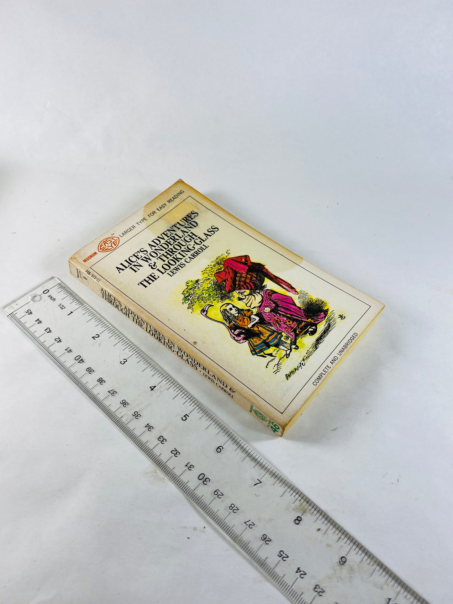 1968 Alice's Adventures in Wonderland & Through the Looking Glass Vintage paperback book by Lewis Carroll.