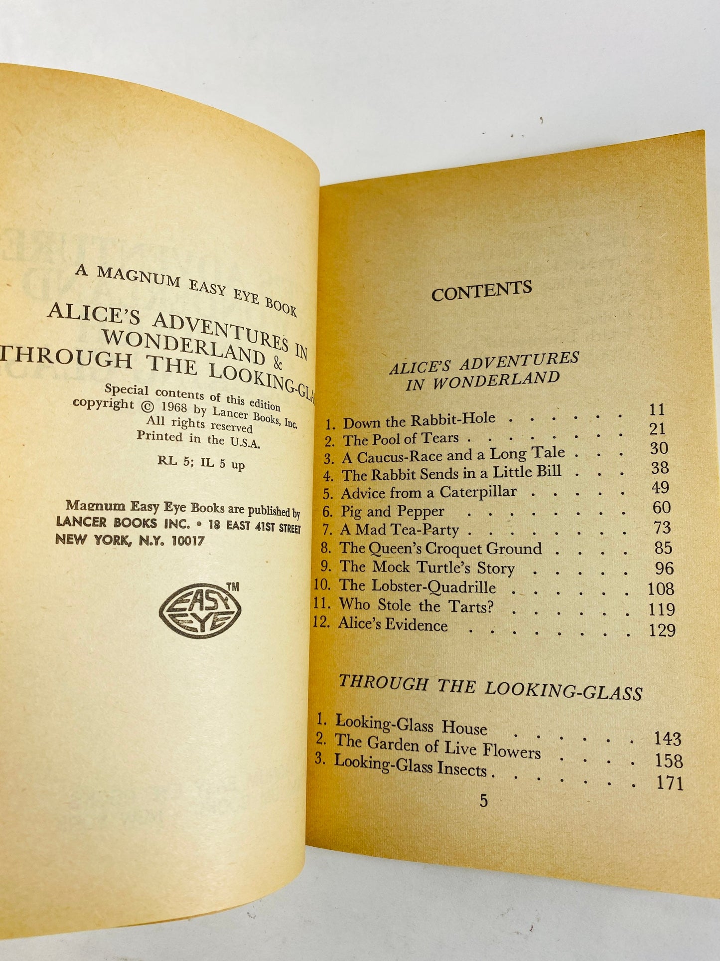 1968 Alice's Adventures in Wonderland & Through the Looking Glass Vintage paperback book by Lewis Carroll.