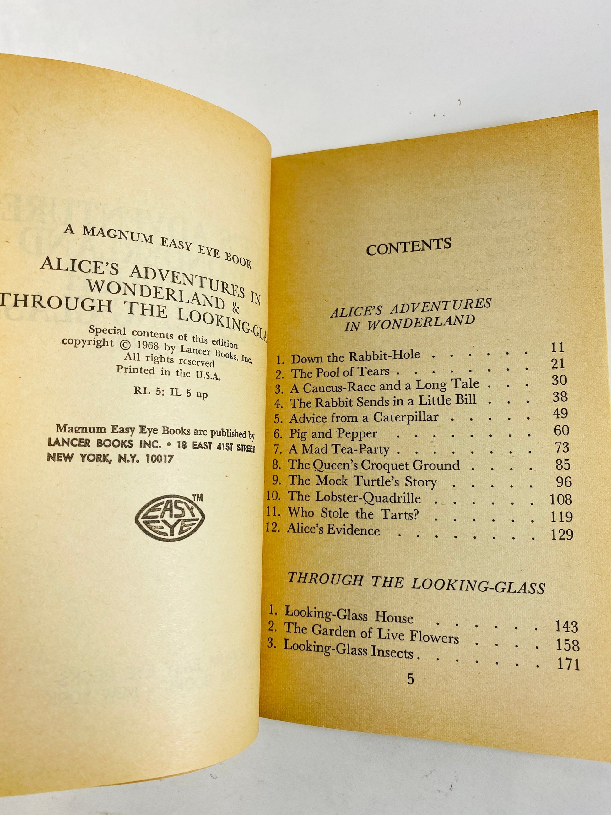 1968 Alice's Adventures in Wonderland & Through the Looking Glass Vintage paperback book by Lewis Carroll.