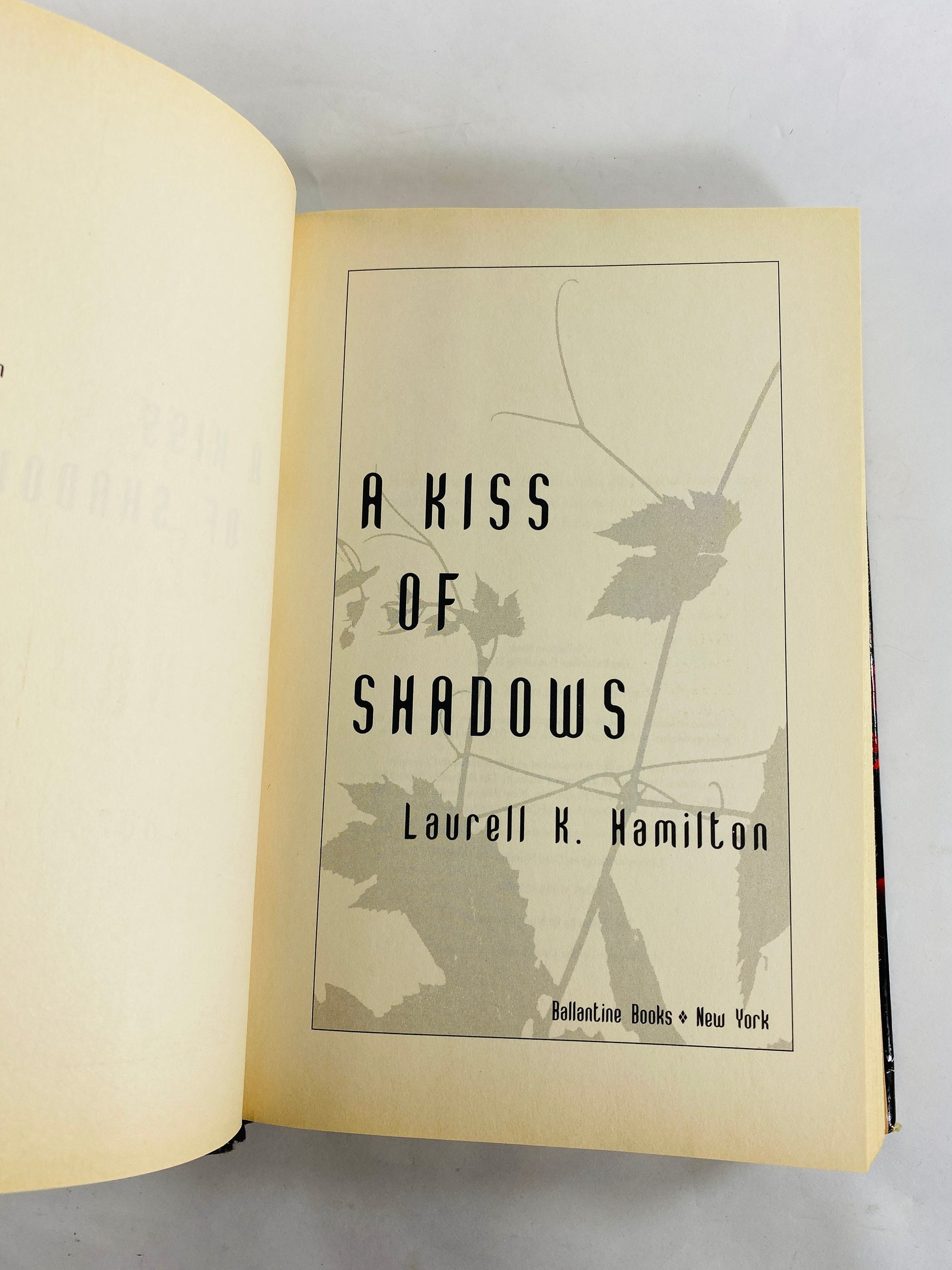 Kiss of Shadows by Laurell Hamilton vintage FIRST EDITION fantasy book circa 2000 about a part brownie, part fey, part human Faerie princess