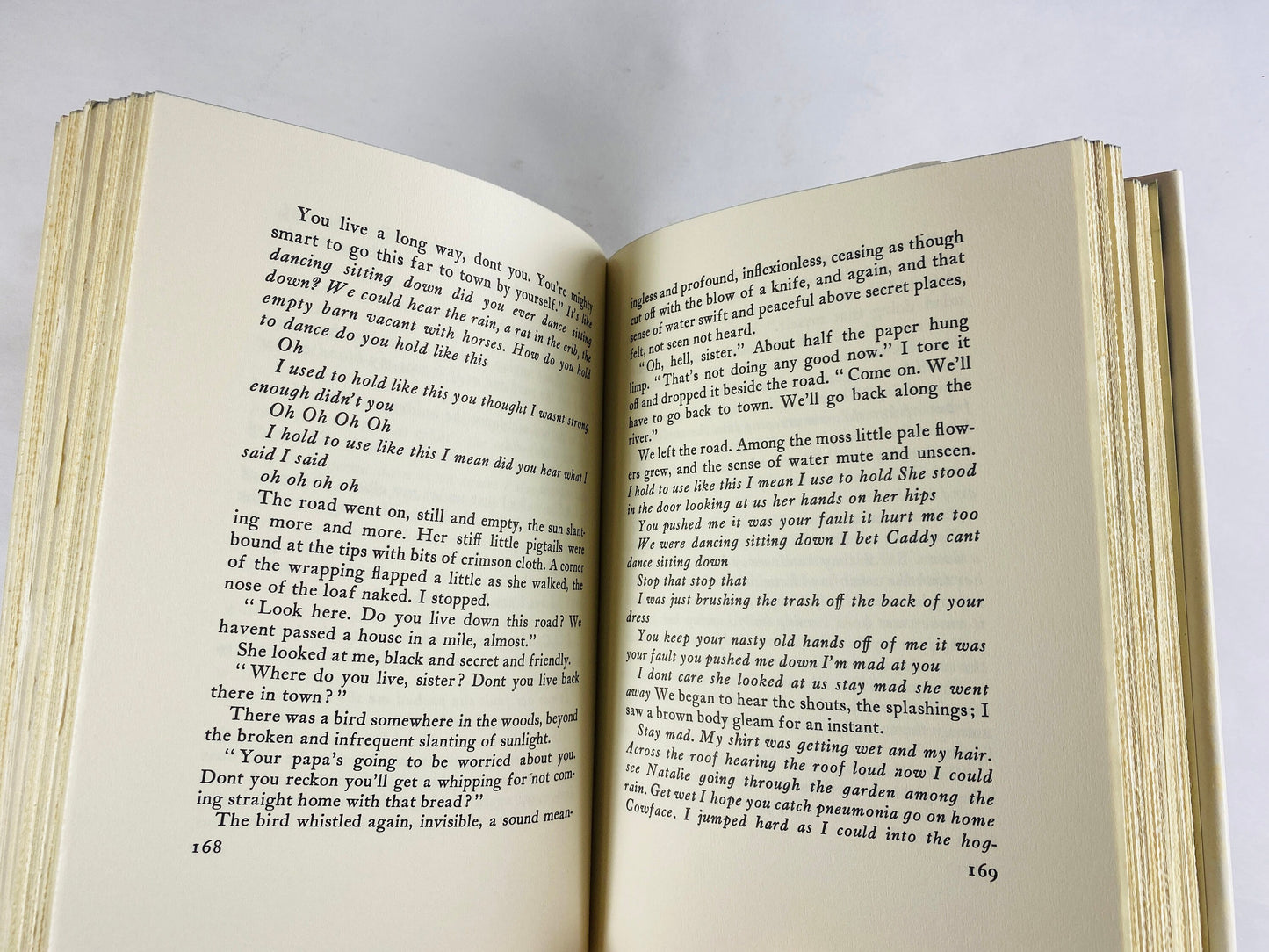 Sound and the Fury vintage book by William Faulkner Tragedy set in Mississippi about former Southern aristocrats and loss of reputation 1984