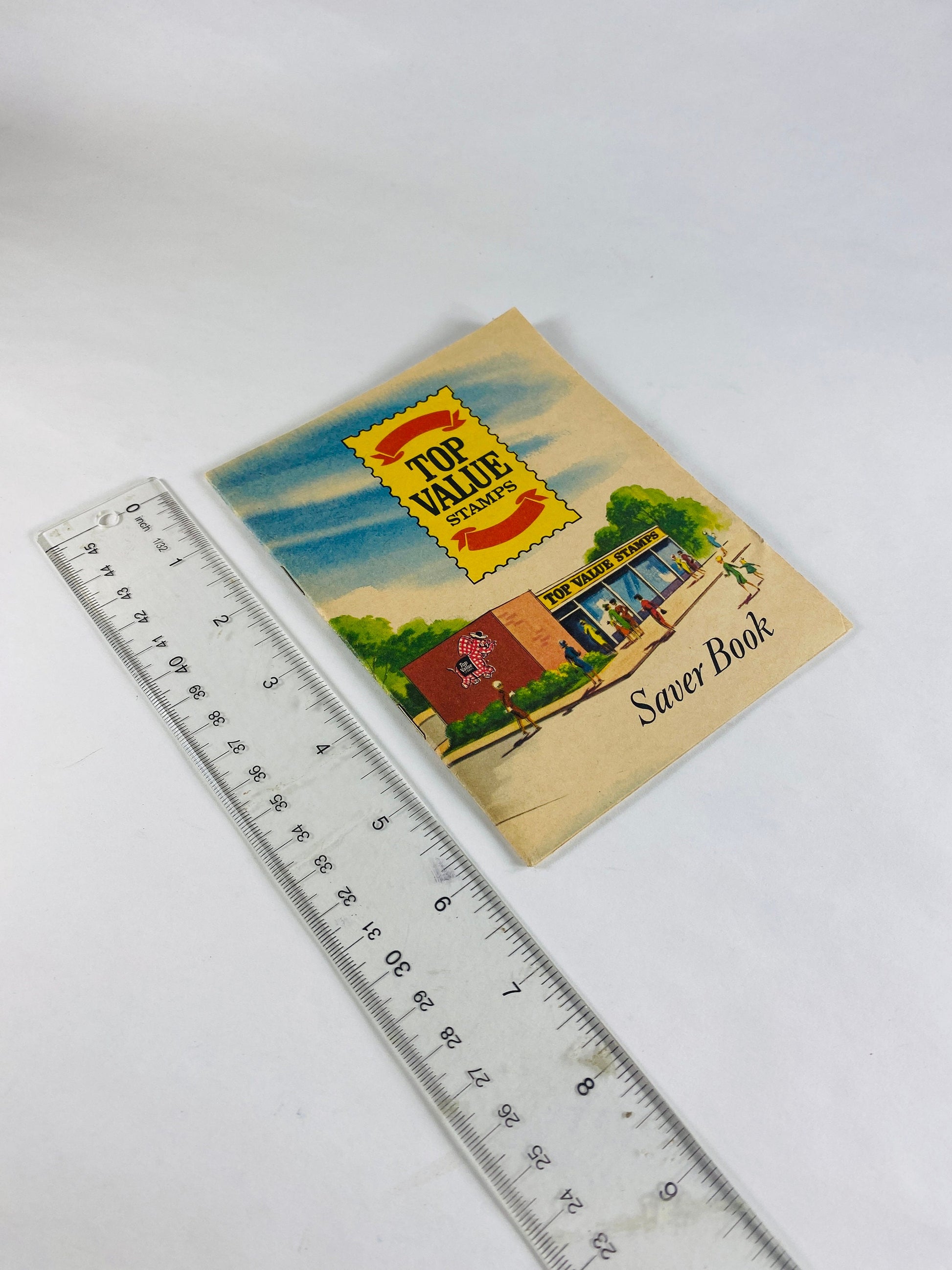 Authentic Top Value Green Stamps Saver booklet with pasted stamps by Top Saver circa 1966. Grocery Store coupons 1960s prop staging decor