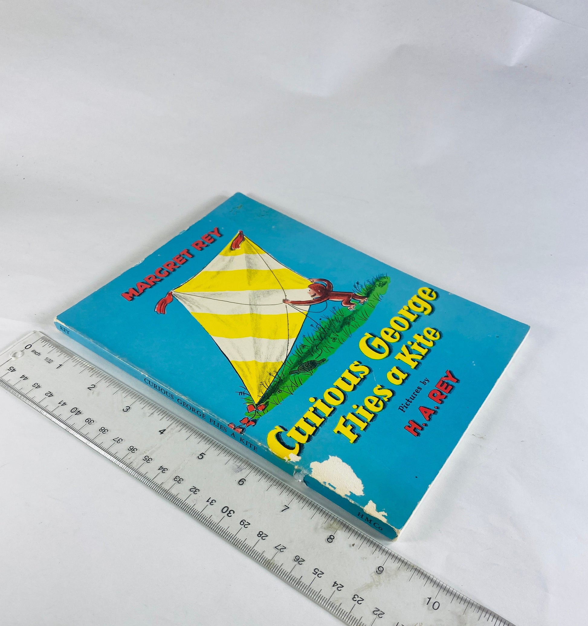 1971 Curious George Flies a Kite Vintage Scholastic paperback book by HA Rey Elementary school reader home decor