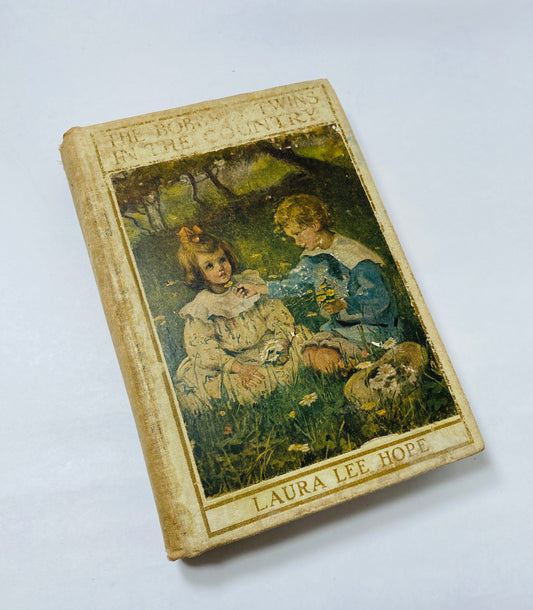 Bobbsey Twins in the Country vintage book circa 1922 by Laura Lee Hope. Antique beige white collectible. Poor Condition