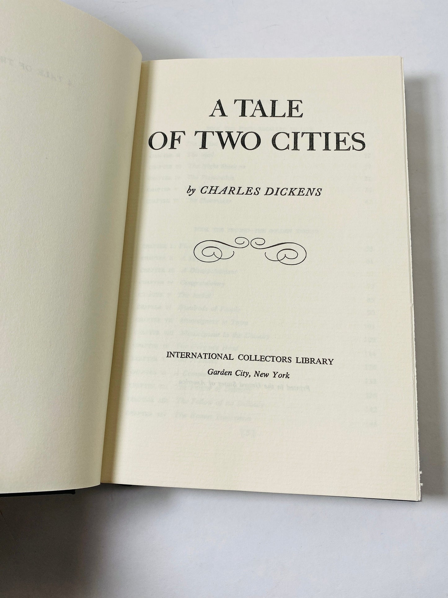 A Tale of Two Cities by Charles Dickens vintage green book with gold gilt lettering. French Revolution.