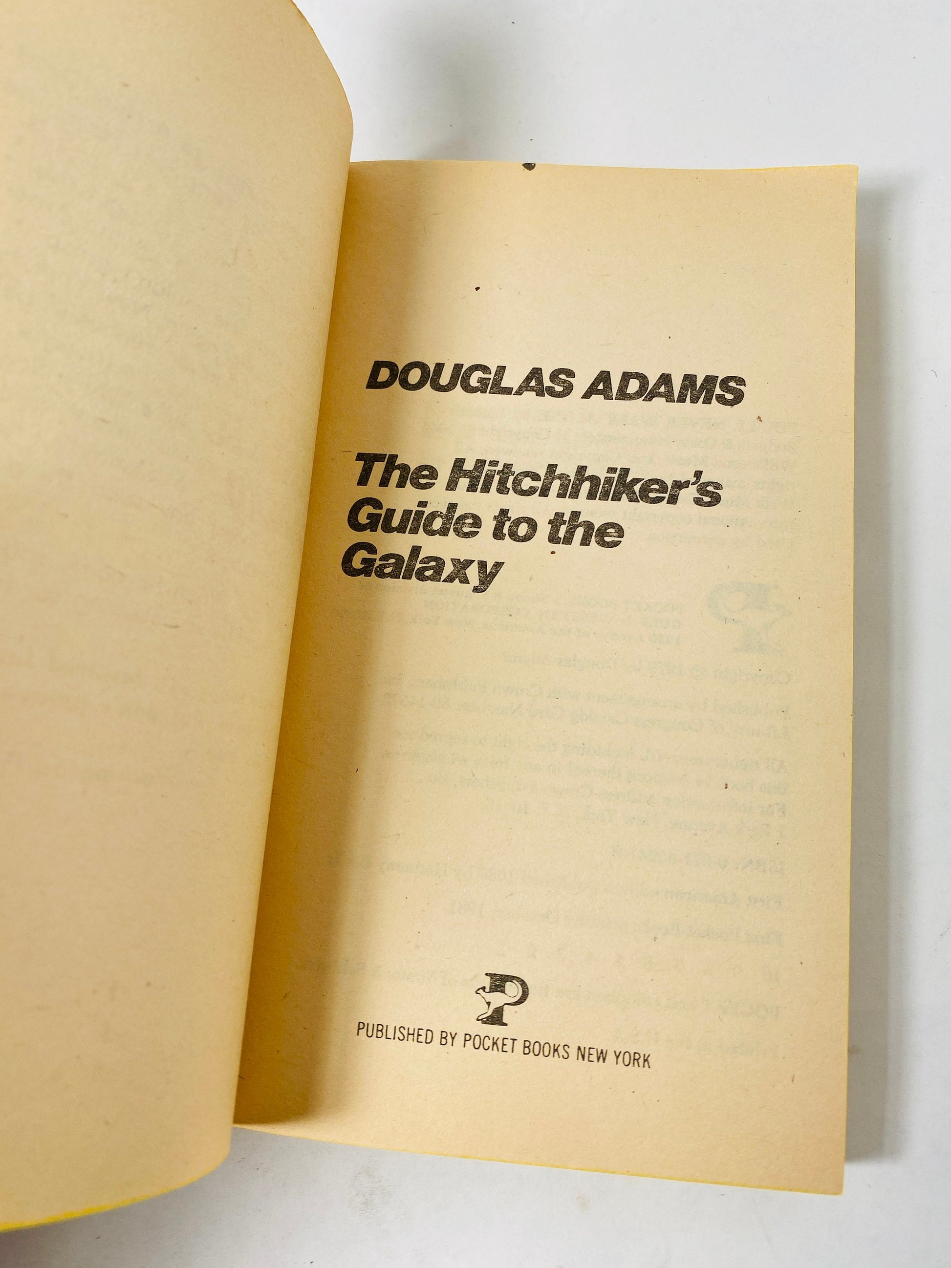 Hitchhiker's Guide to the Galaxy. Vintage Douglas Adams paperback book circa 1981. FIRST POCKET printing.