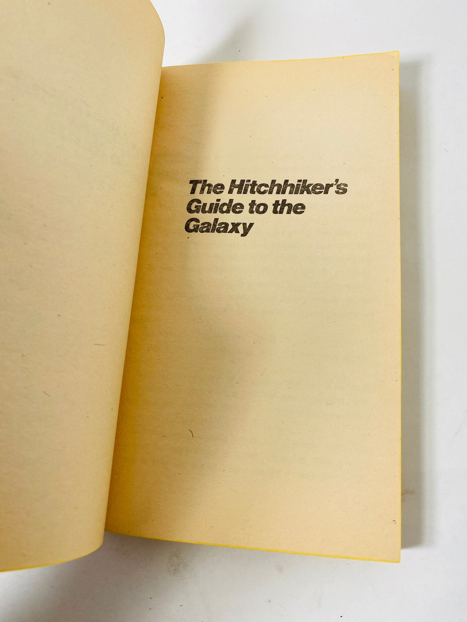 Hitchhiker's Guide to the Galaxy. Vintage Douglas Adams paperback book circa 1981. FIRST POCKET printing.