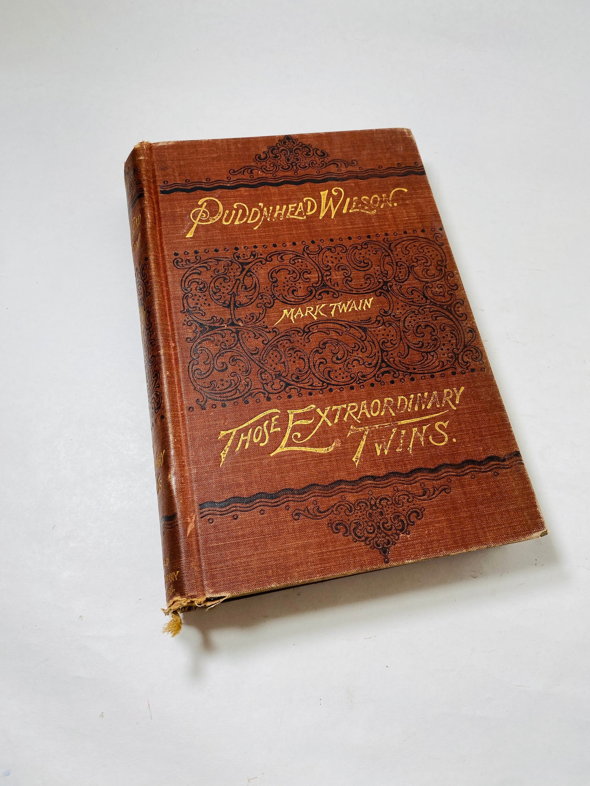 Tragedy of Pudd'nhead FIRST EDITION book by Mark Twain circa 1894 Extraordinary Twins brown embossed gold cover Former Library Book