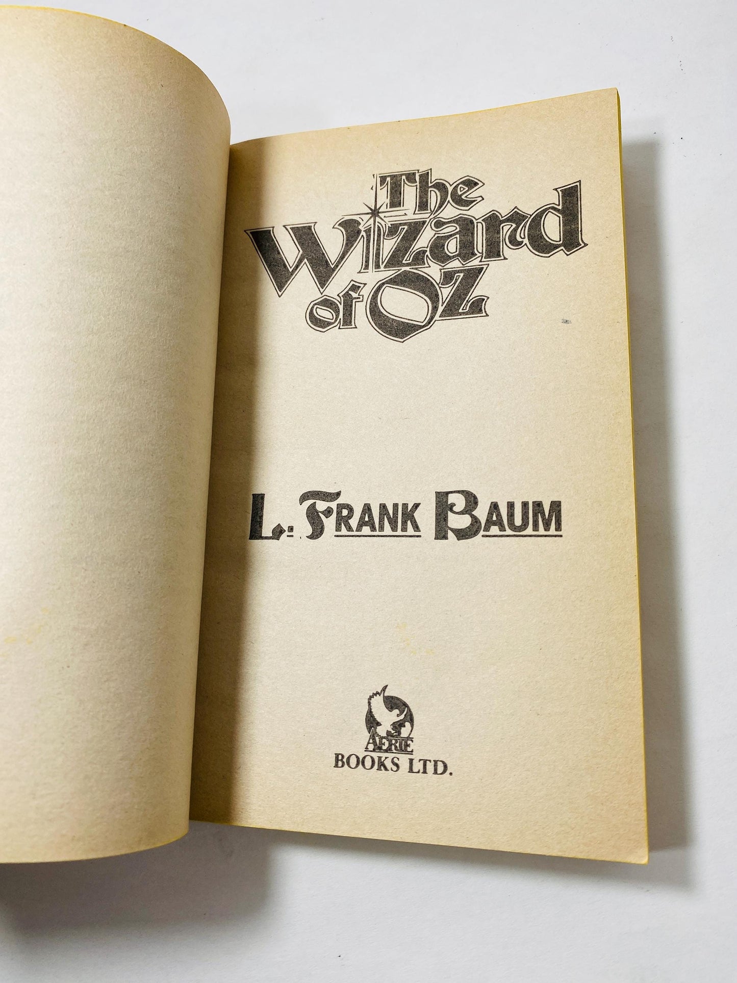 Wizard of Oz vintage paperback book by L Frank Baum circa 1988 Retro yellow decor stocking stuffer