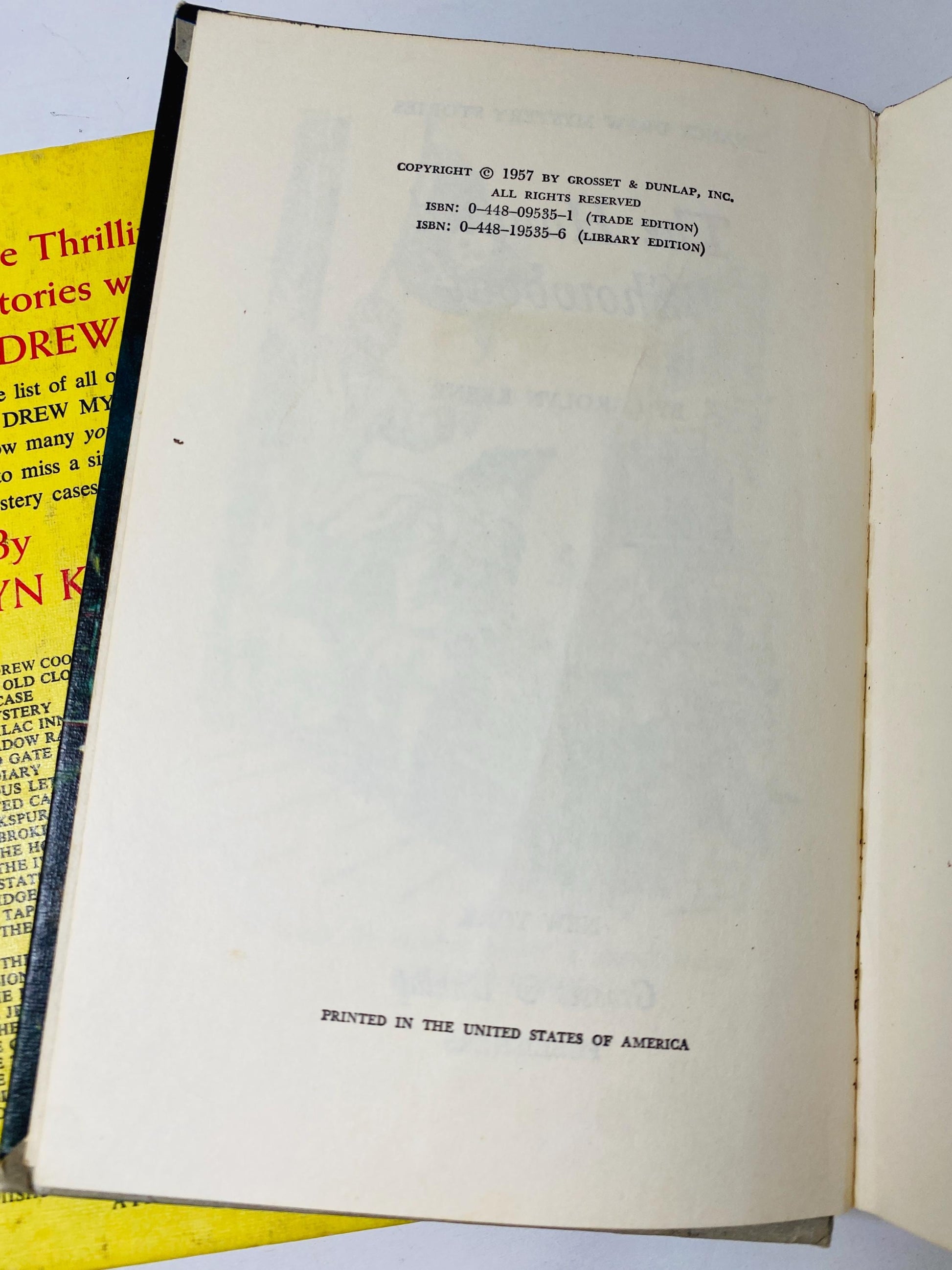 1957 Nancy Drew Mystery Stories Carolyn Keene Haunted Showboat Cue Tapping Heels Secret Old Clock Vintage books black & white endpapers