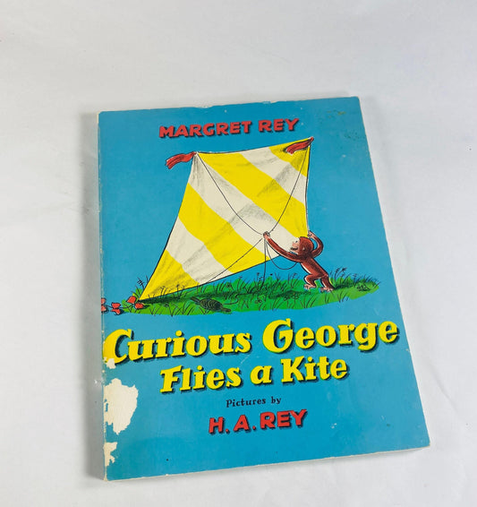 1971 Curious George Flies a Kite Vintage Scholastic paperback book by HA Rey Elementary school reader home decor