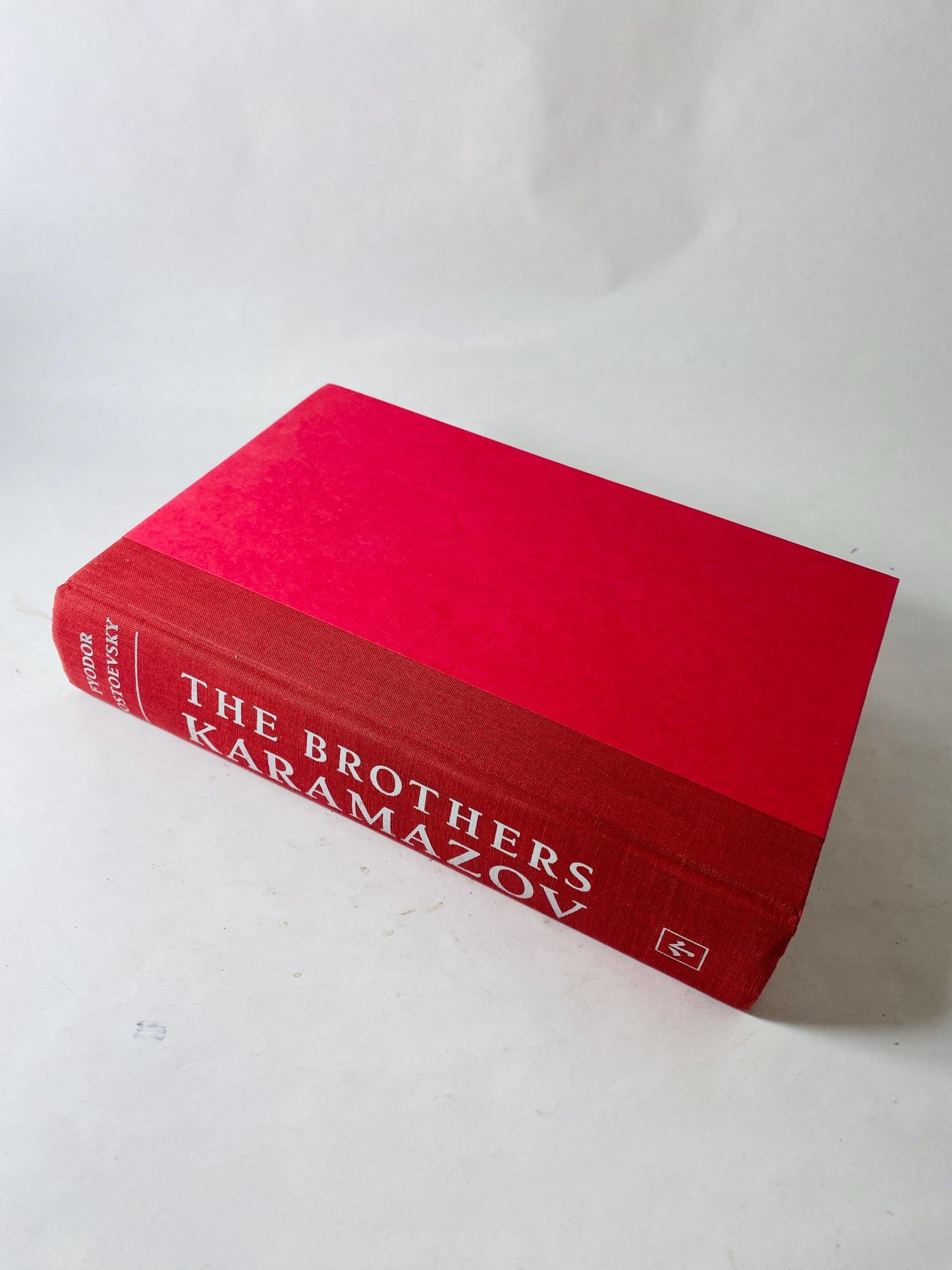 Brothers Karamazov by Fyodor Dostoevsky Vintage red leatherette book circa 1989. Examines ethics of God and free will. Rafael Palacios
